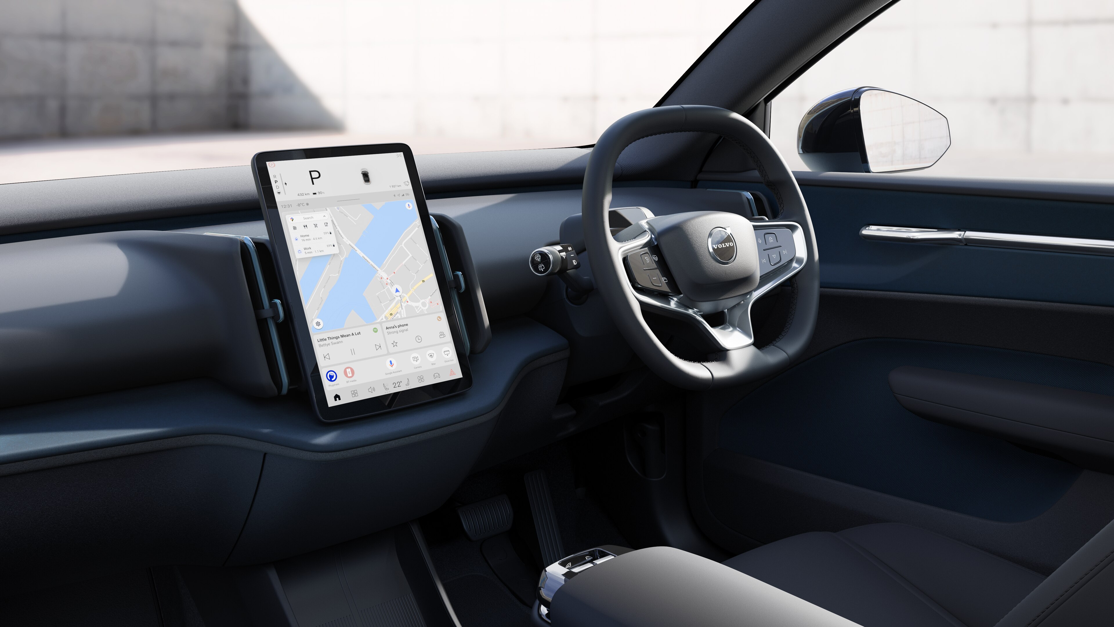 Volvo car interior showing dashboard, steering wheel, and center console with digital display in an open road background.