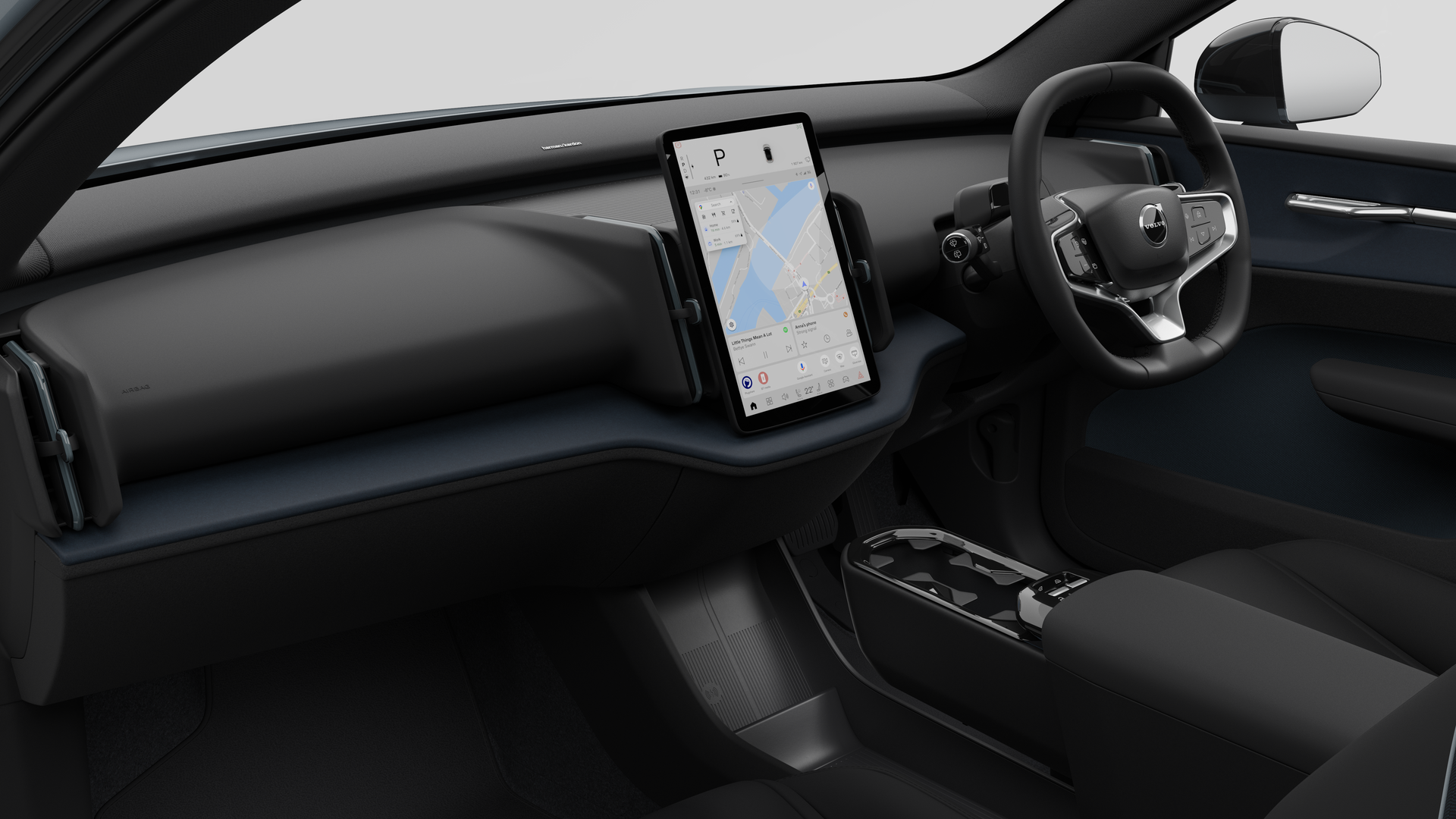 มุมมองภายในของรถยนต์ Volvo ที่แสดงแผงหน้าปัด พวงมาลัย คอนโซลกลาง และหน้าจอแสดงผลดิจิทัลในพื้นหลังสตูดิโอธรรมดา