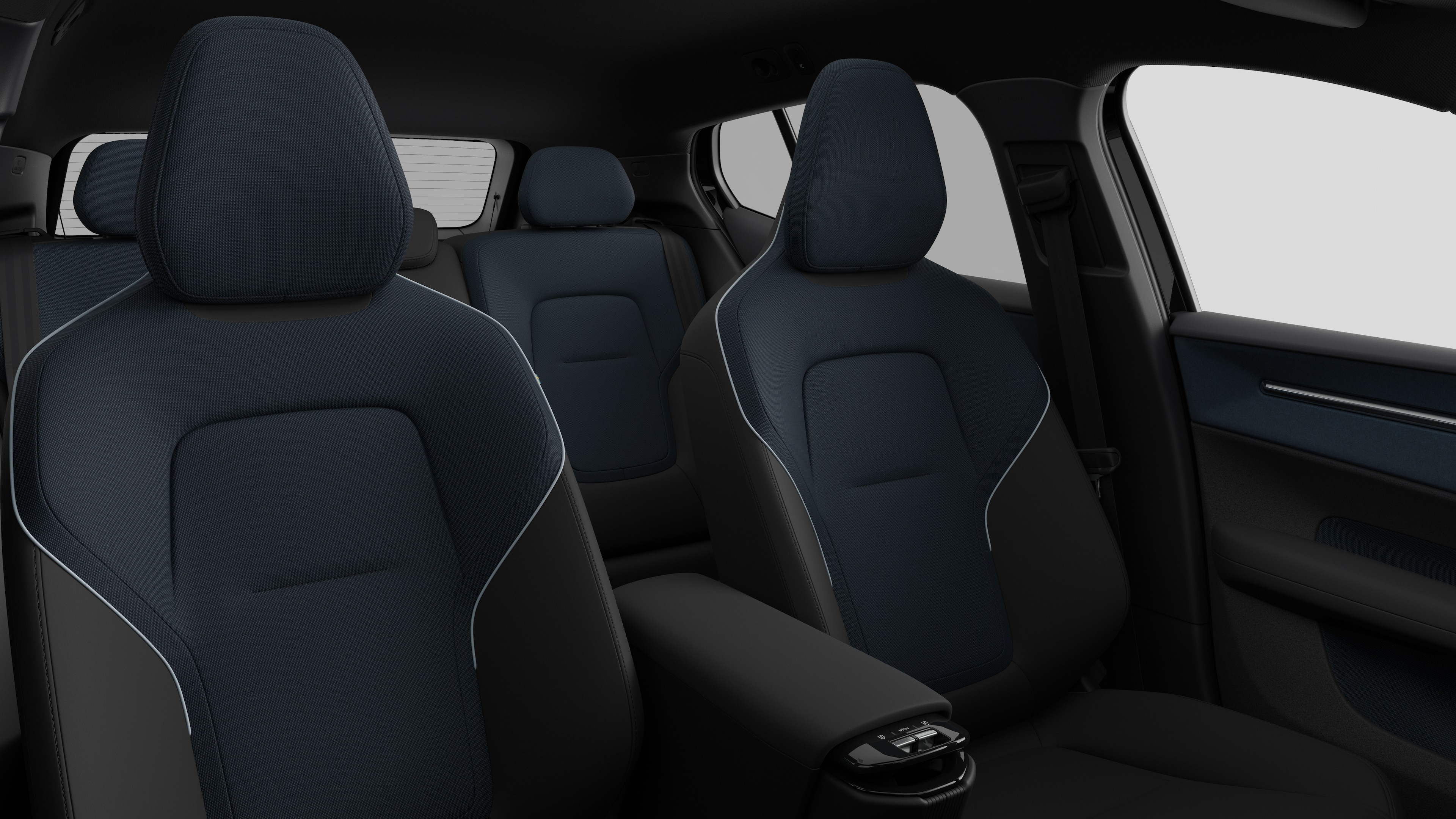 Volvo car interior showing rear passenger seats and center console in plain studio background.