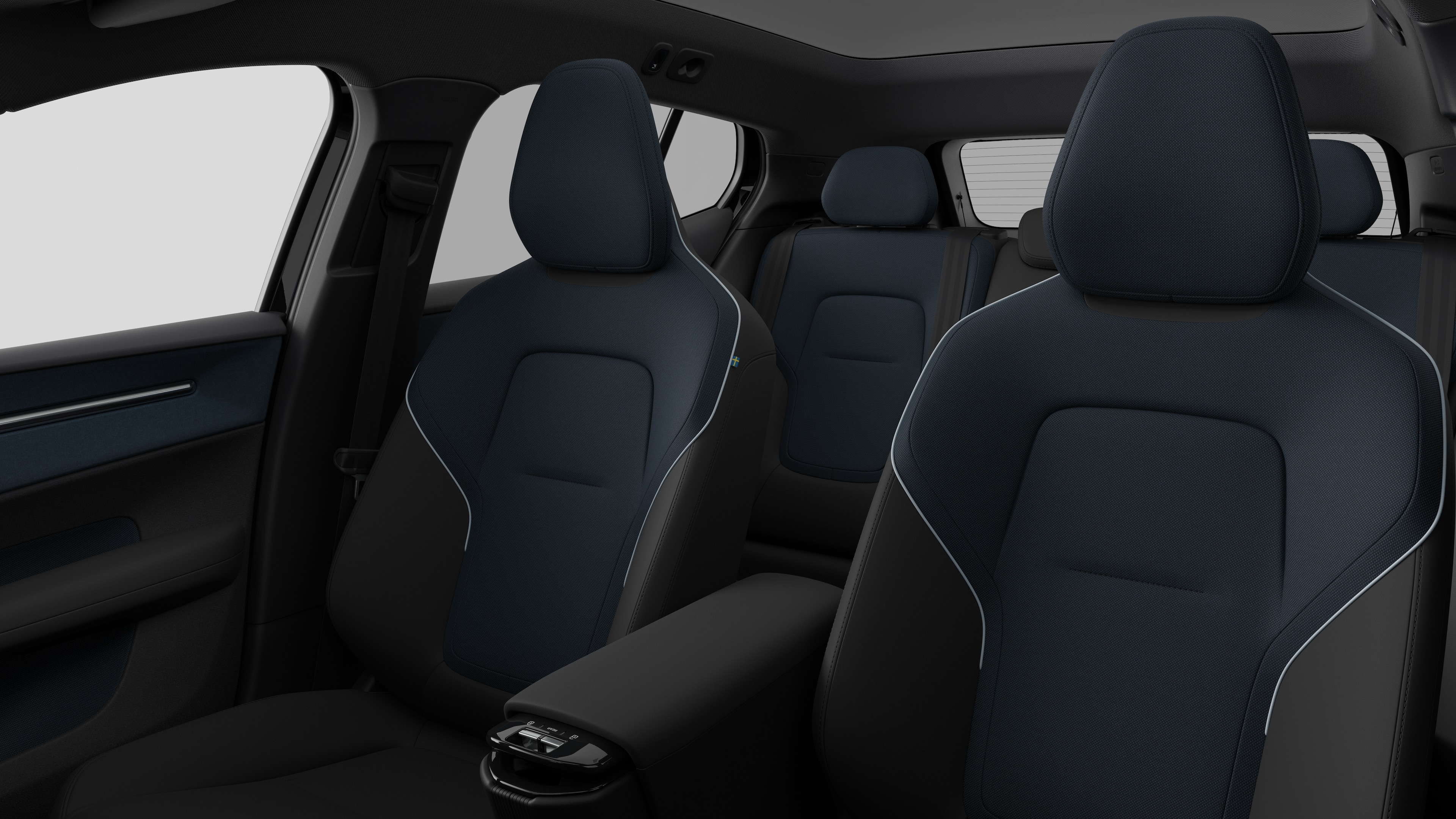 Intérieur d’une Volvo montrant les sièges passagers arrière et la console centrale dans un studio uni.
