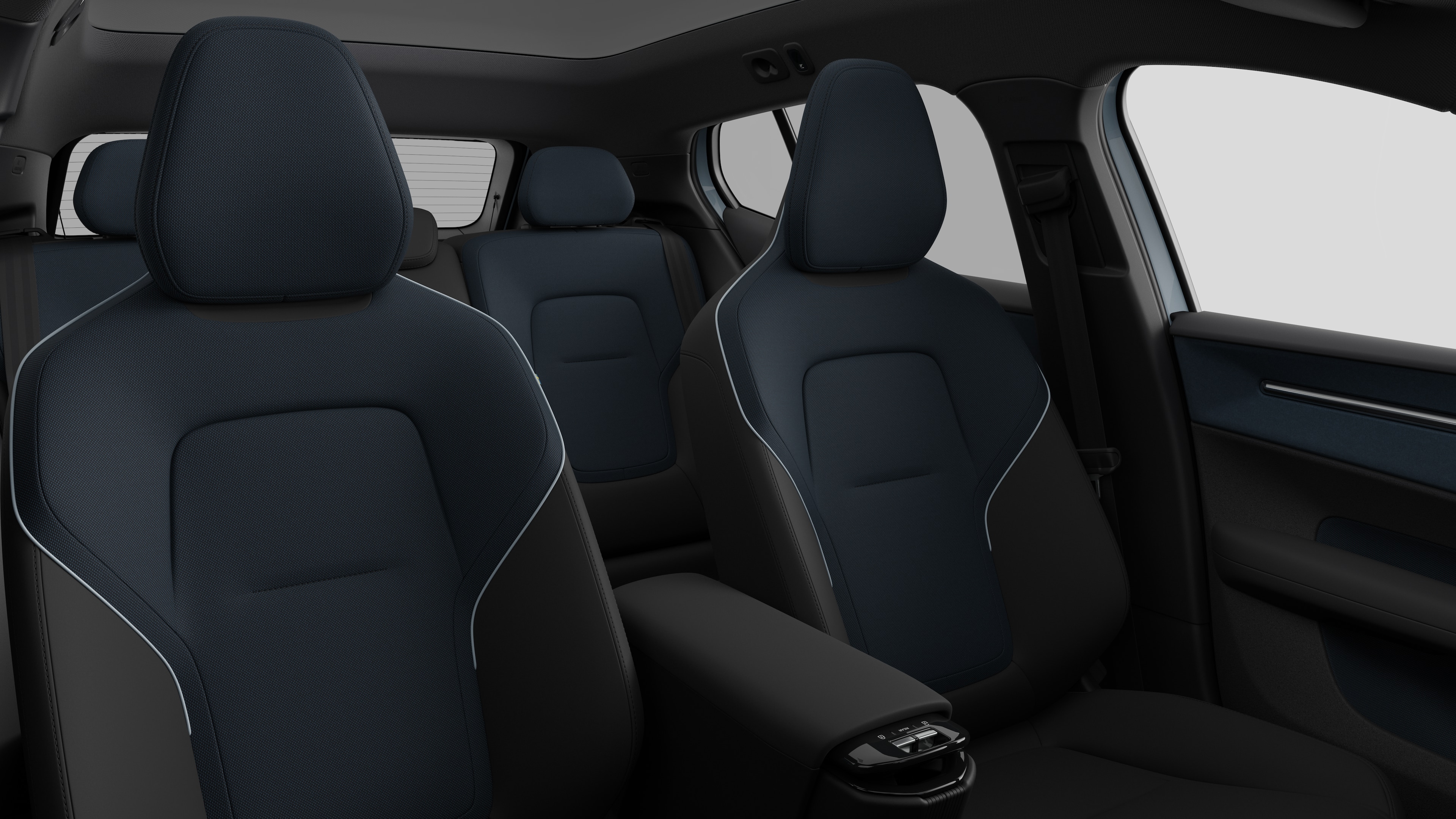 Volvo car interior showing rear passenger seats and centre console in plain studio background.