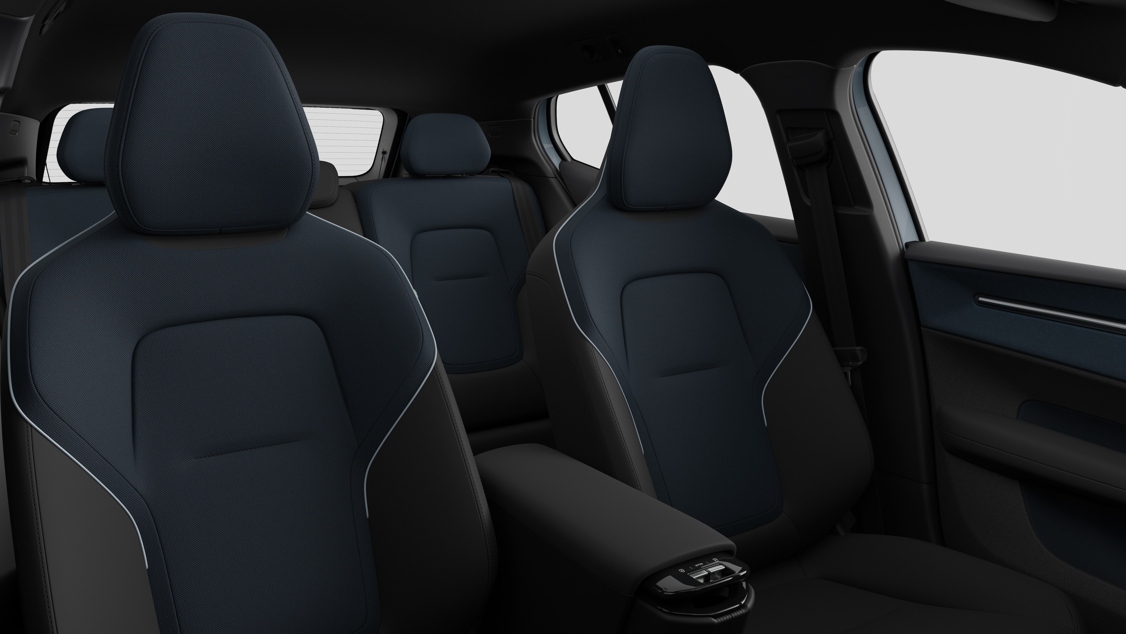 Volvo car interior showing rear passenger seats and center console in plain studio background.