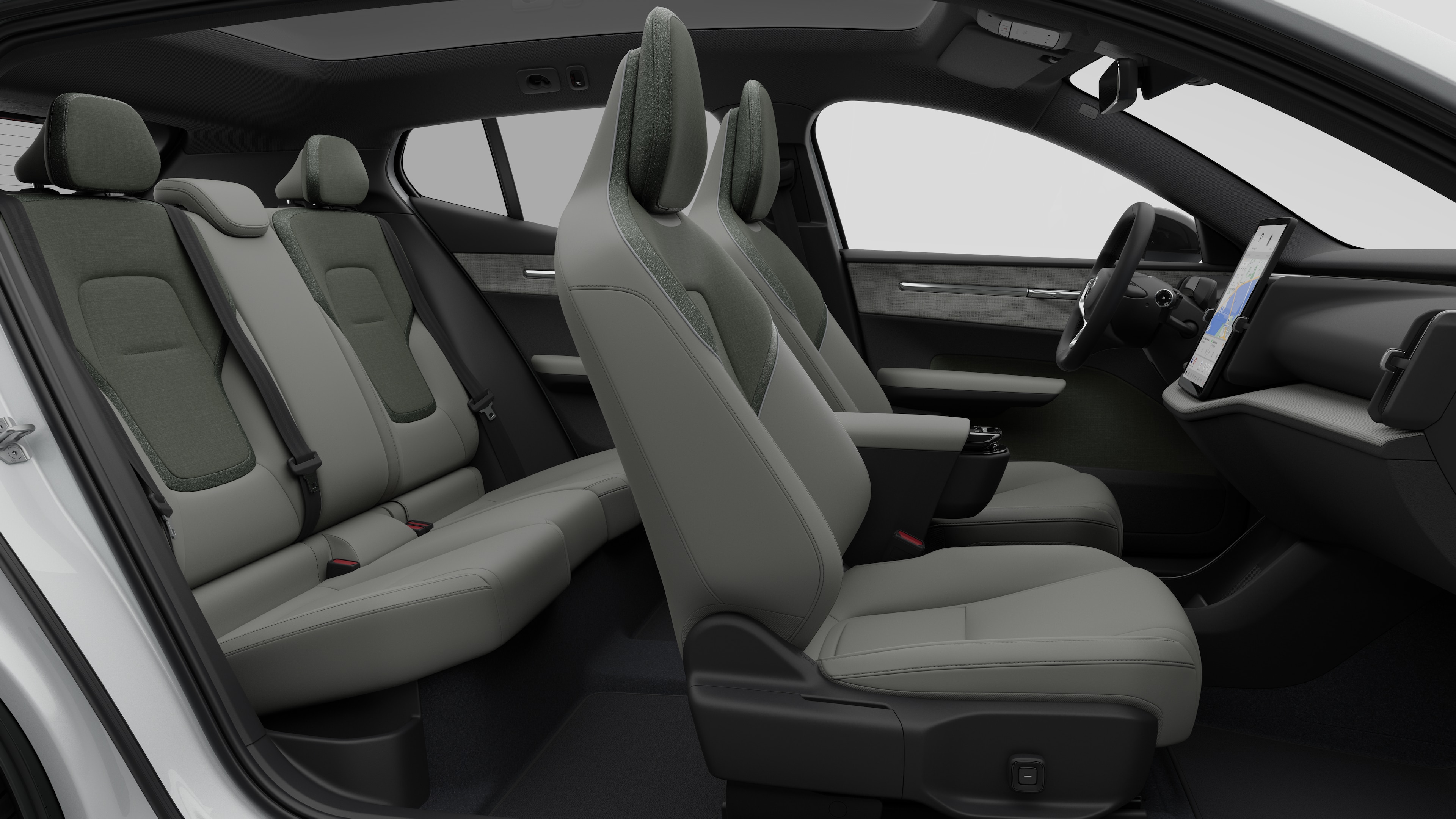 Volvo car interior side view showcasing front seats, rear passenger seats, steering wheel, dashboard, and center console, set against plain studio background.