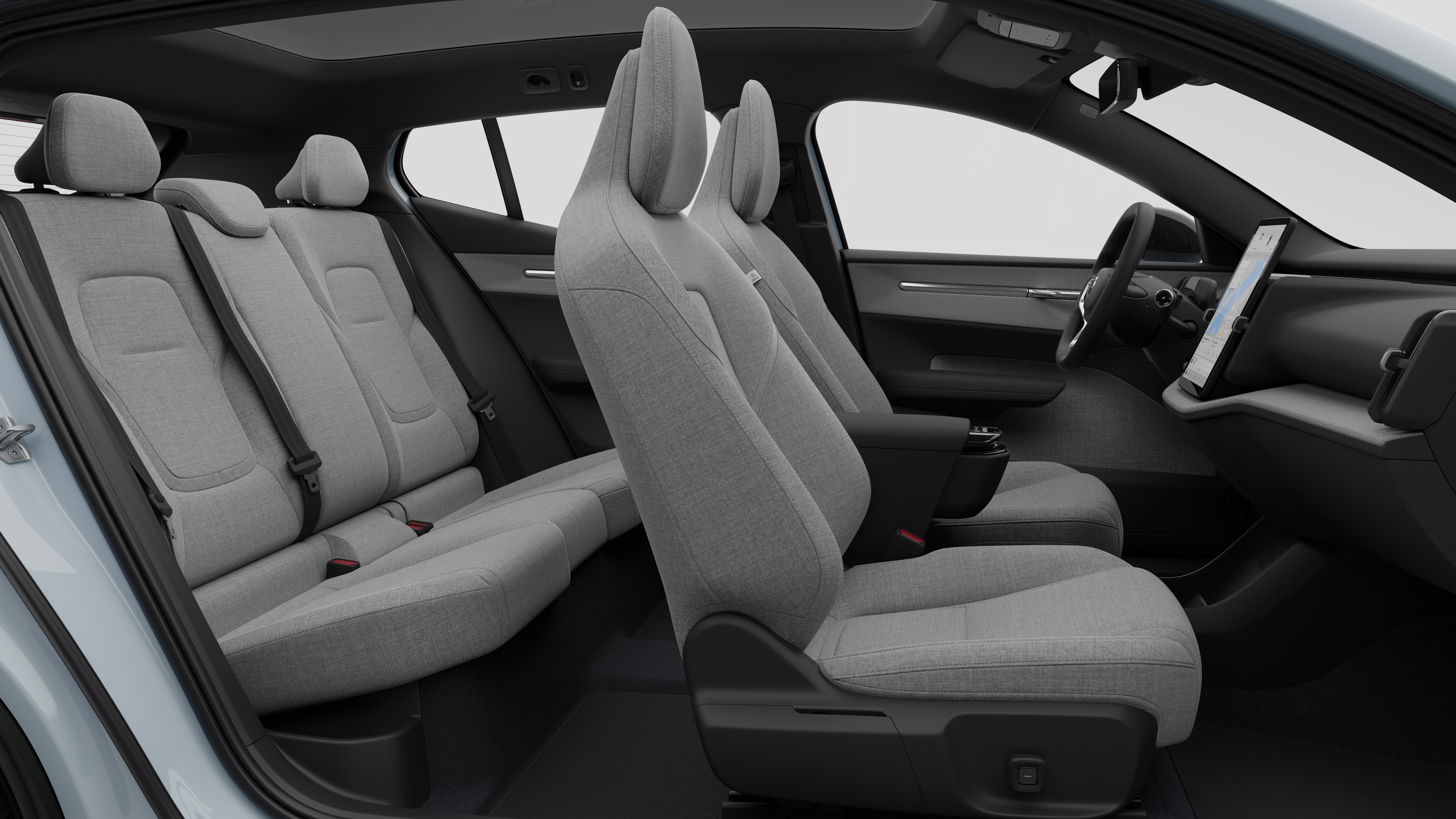 Vista lateral do interior do automóvel Volvo a mostrar os bancos dianteiros, os bancos do passageiro traseiro, o volante, o painel de instrumentos e a consola central, contra um fundo de estúdio simples.