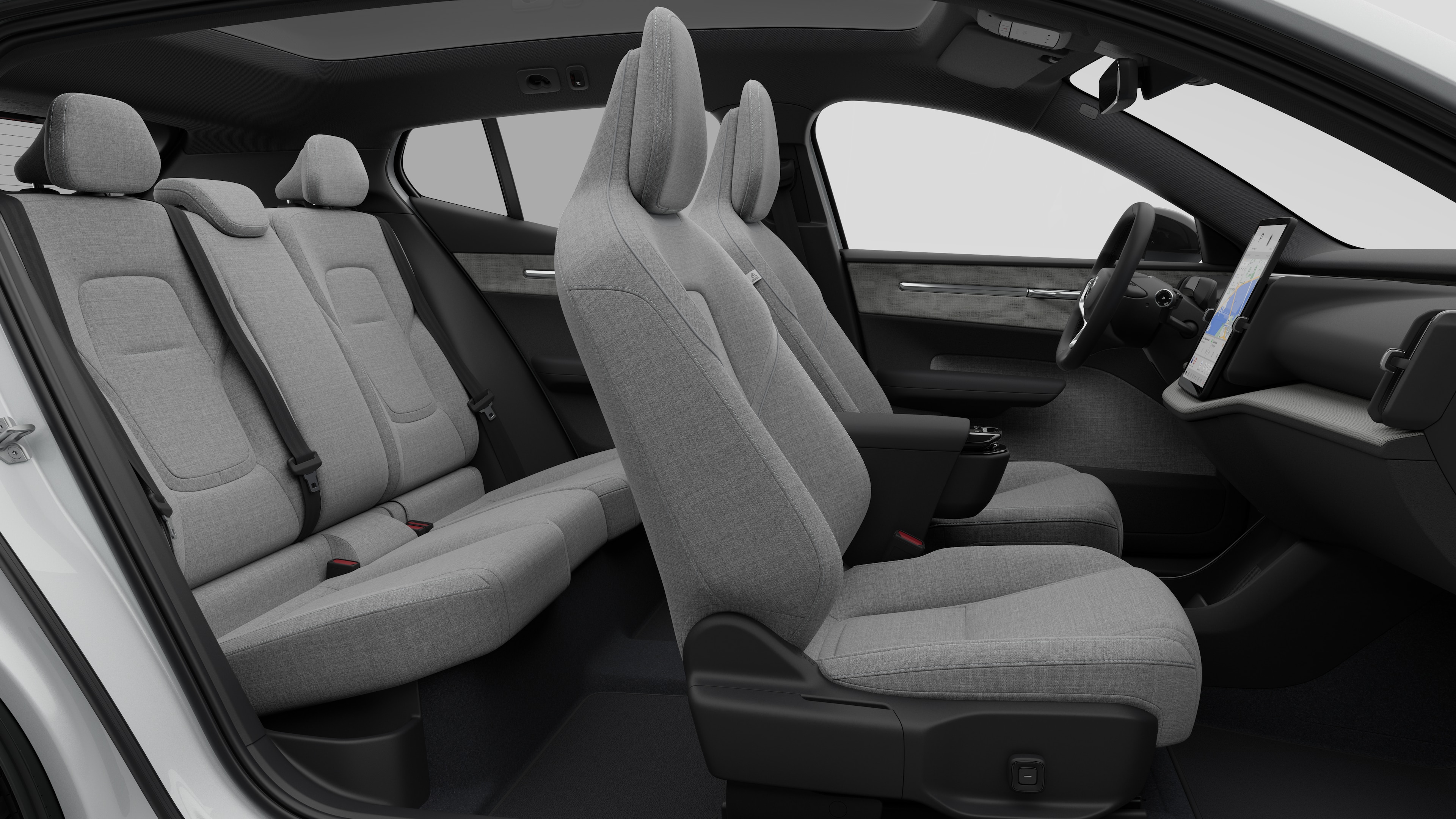Volvo car interior side view showcasing front seats, rear passenger seats, steering wheel, dashboard, and center console, set against plain studio background.