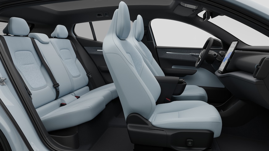 Volvo car interior side view showcasing front seats, rear passenger seats, steering wheel, dashboard, and center console, set against plain studio background.