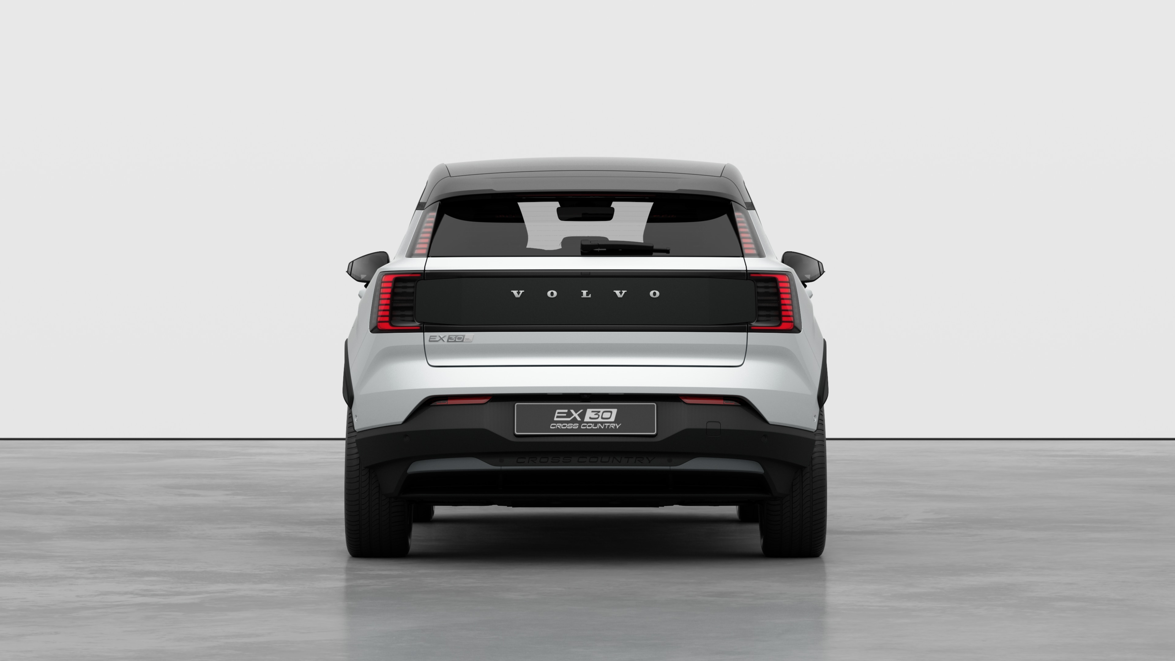 無地のスタジオを背景にしたボルボ車のリアビュー。