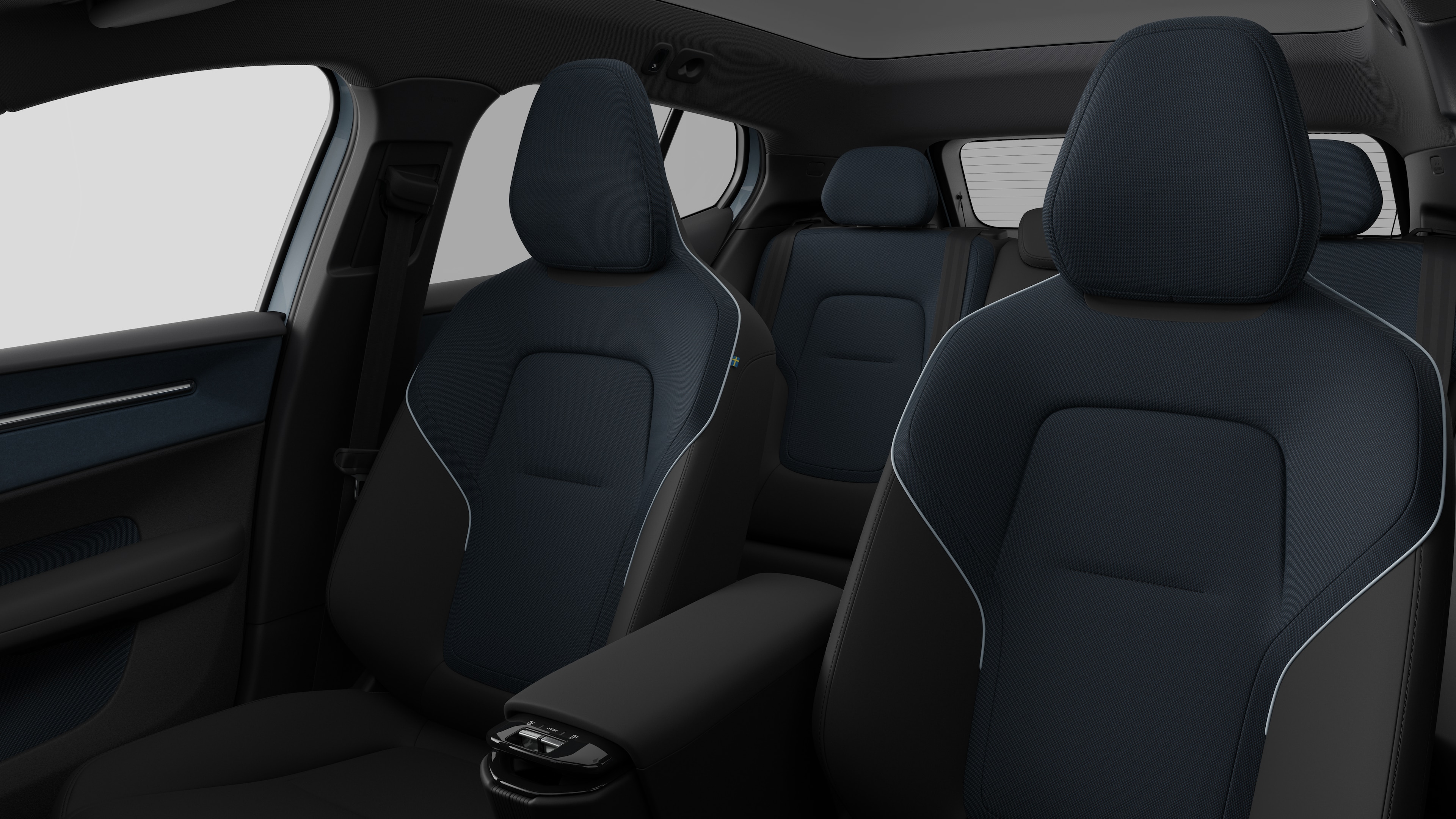 L’intérieur d’une Volvo montrant les sièges du passager arrière et la console centrale sur un fond de studio uni.