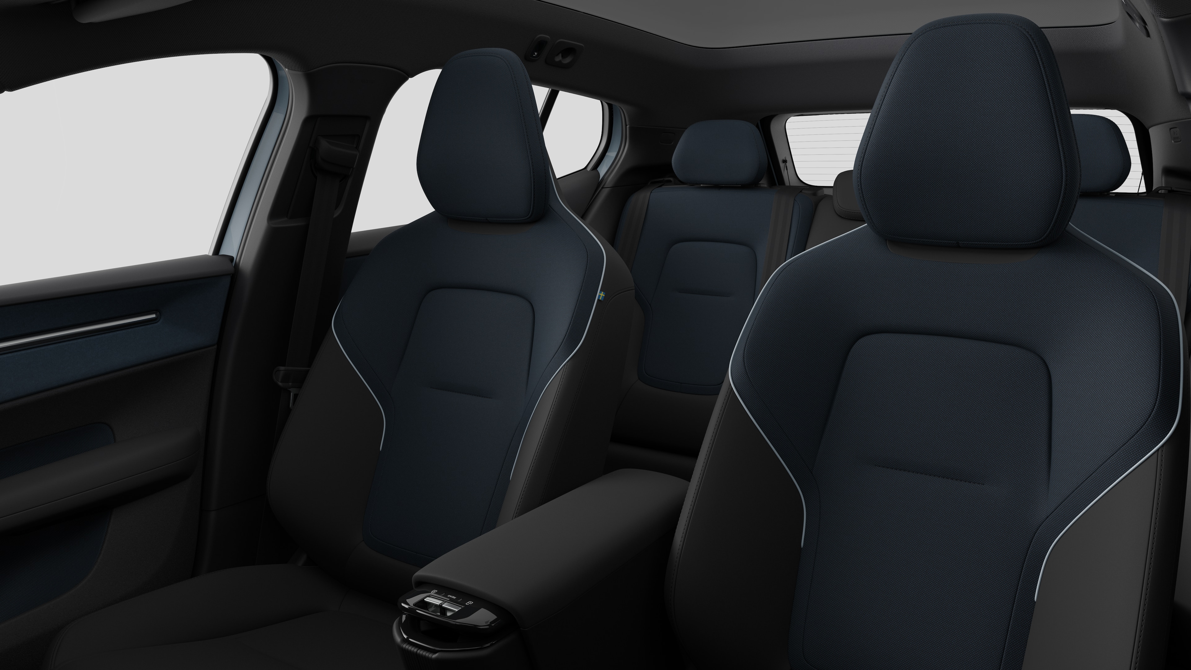 Volvo-bilinteriør med passagersæder bagtil og midterkonsol i almindelig studiebaggrund.