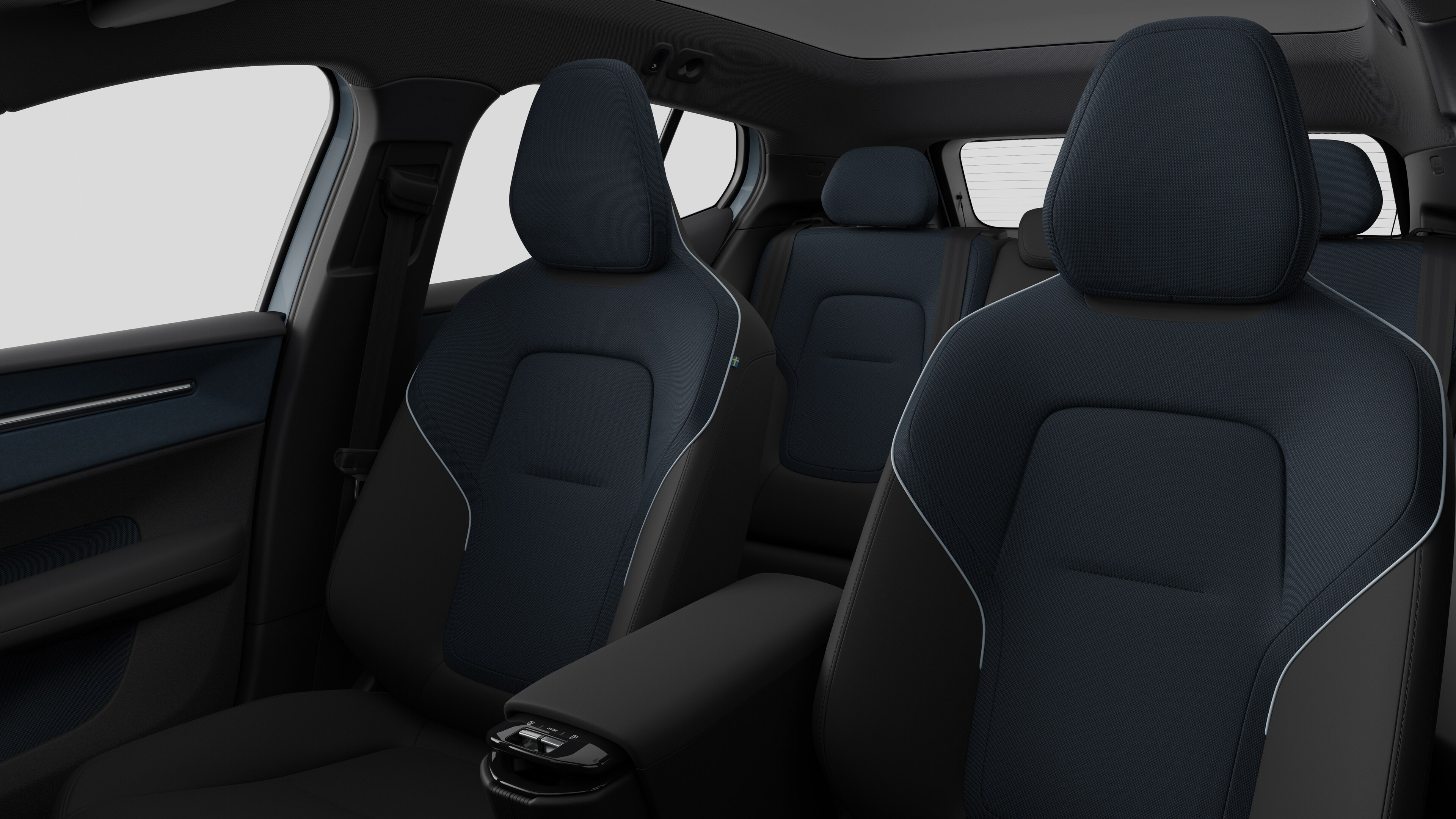 Interiér vozidla Volvo so zadnými sedadlami spolujazdcov a stredovou konzolou v pozadí obyčajného štúdia.