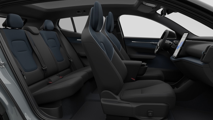 Volvo car interior side view showcasing front seats, rear passenger seats, steering wheel, dashboard, and center console, set against plain studio background.