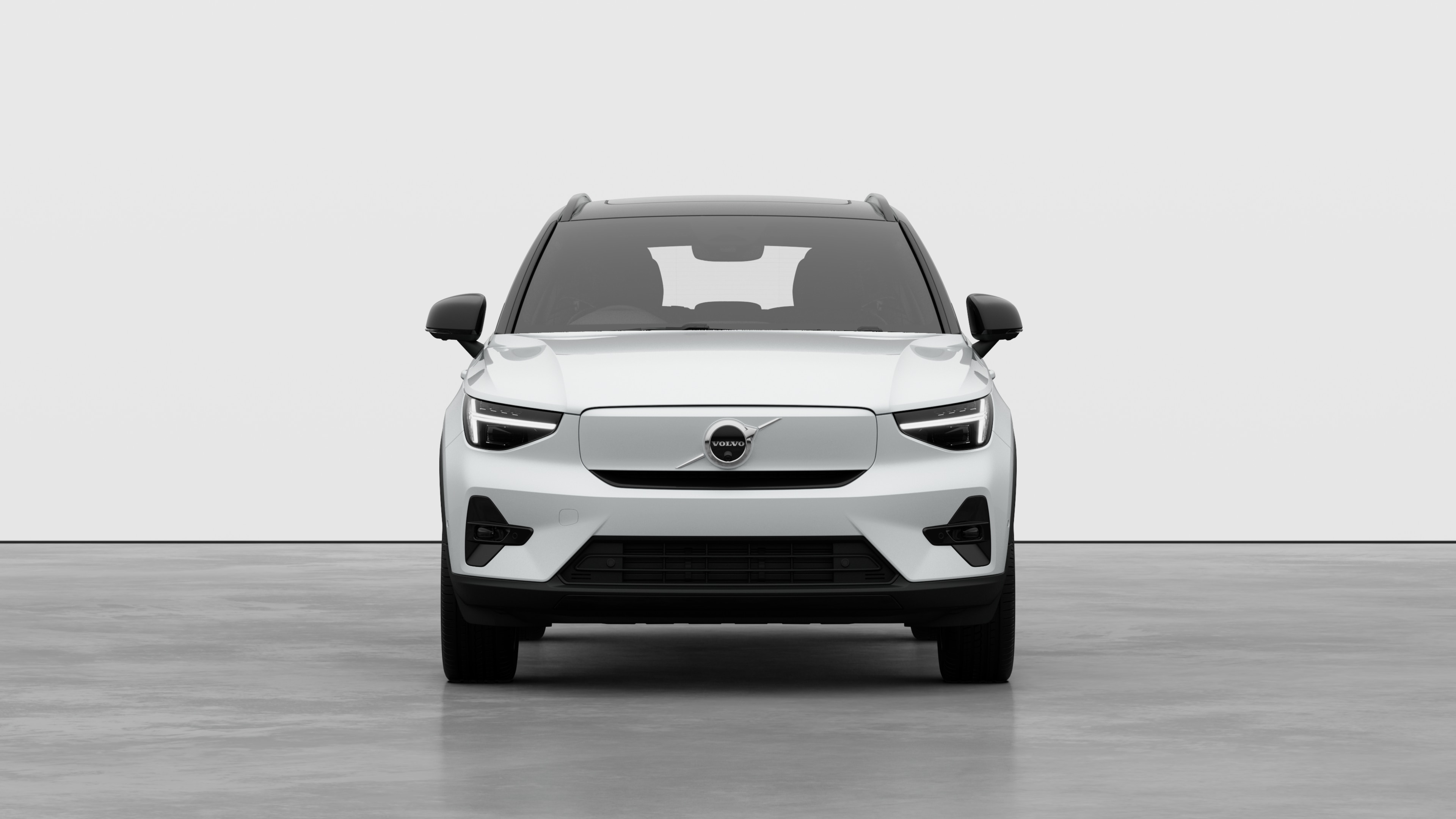 Front view of a Volvo car in a plain studio background.