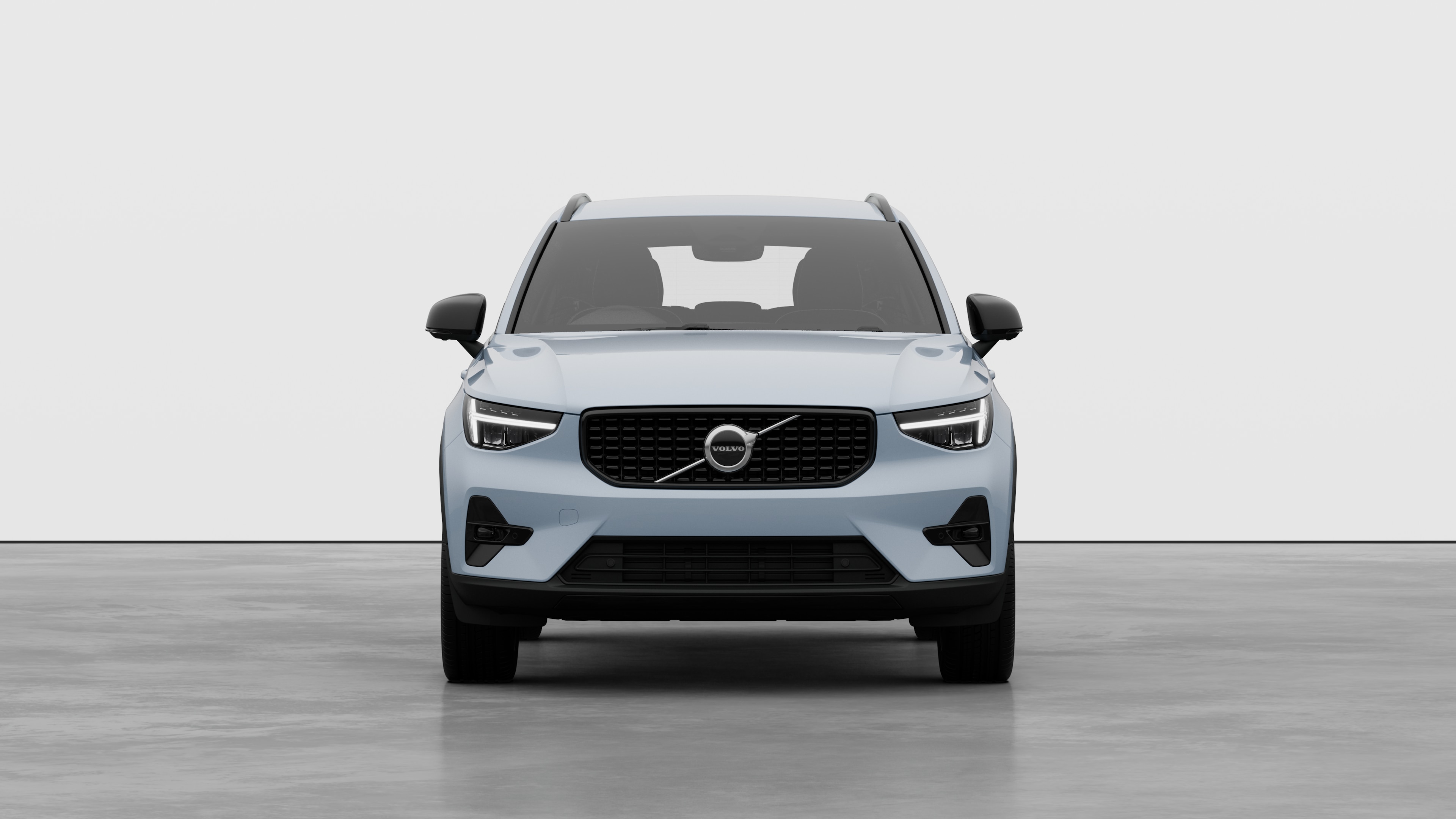 Front view of a Volvo car in a plain studio background.