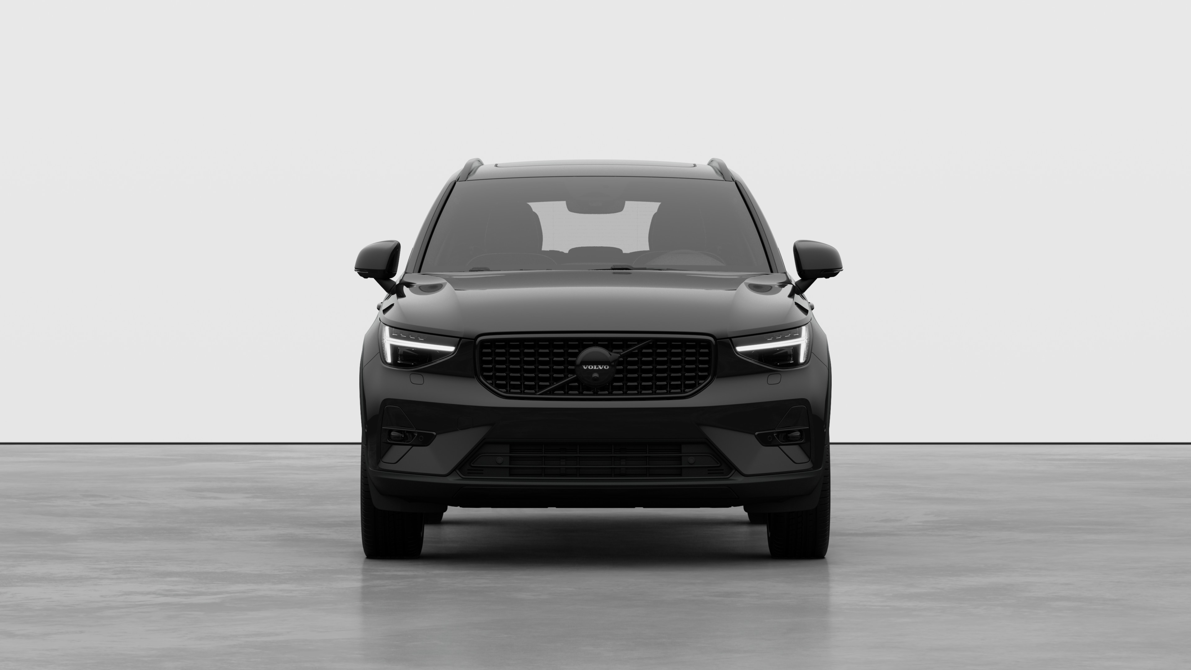 Front view of a Volvo car in a plain studio background.