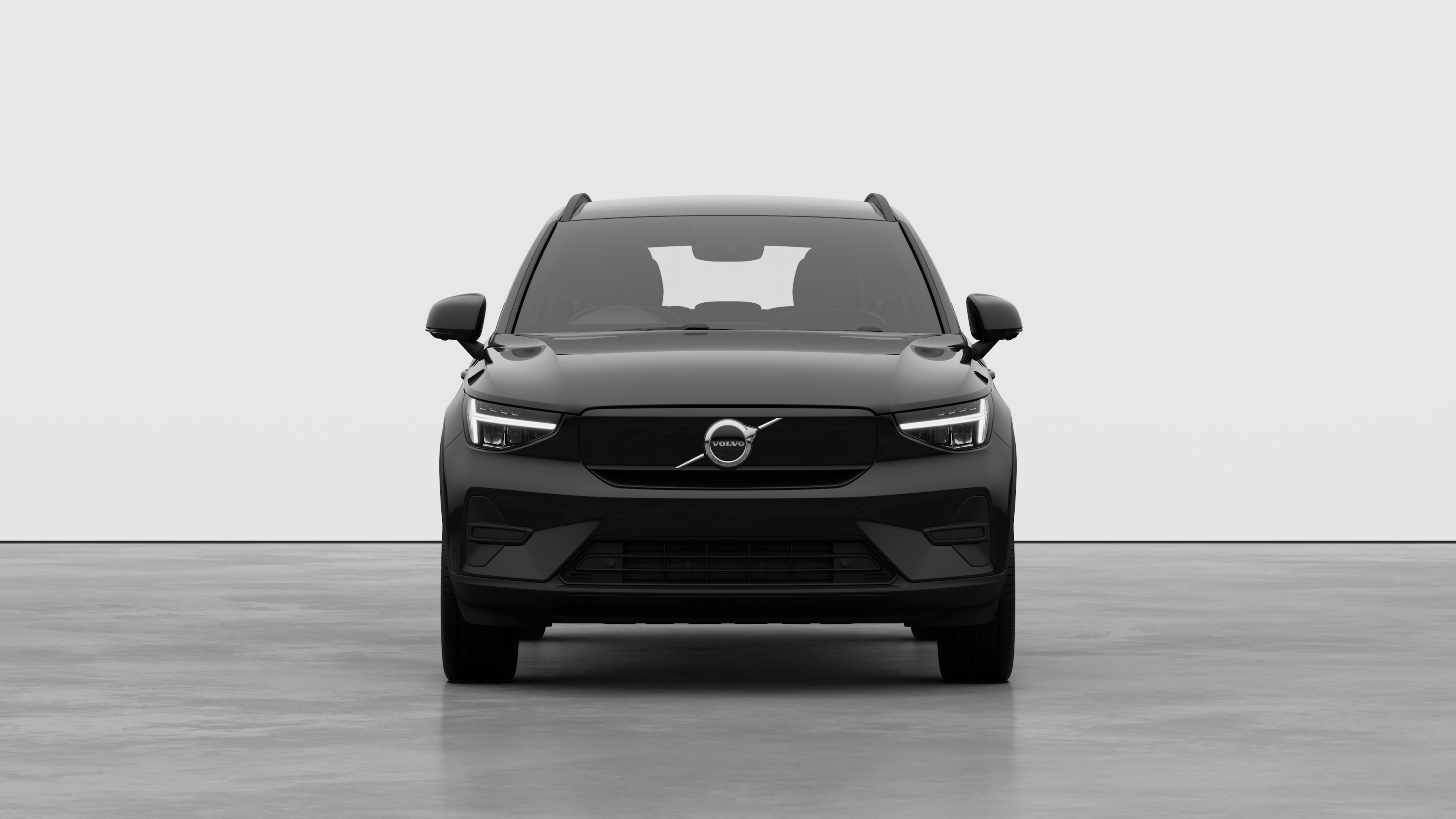 Front view of a Volvo car in a plain studio background.