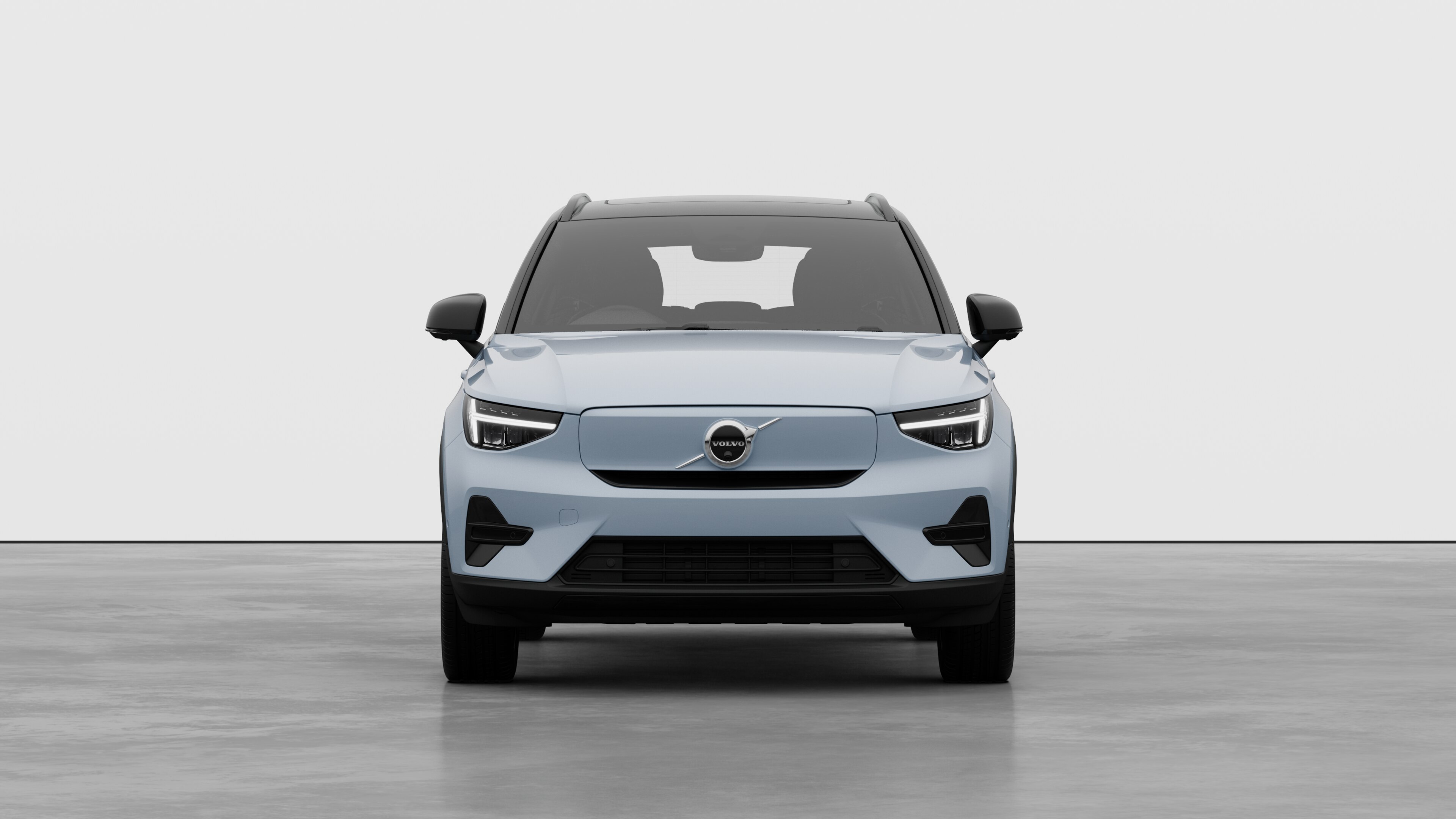 Front view of a Volvo car in a plain studio background.