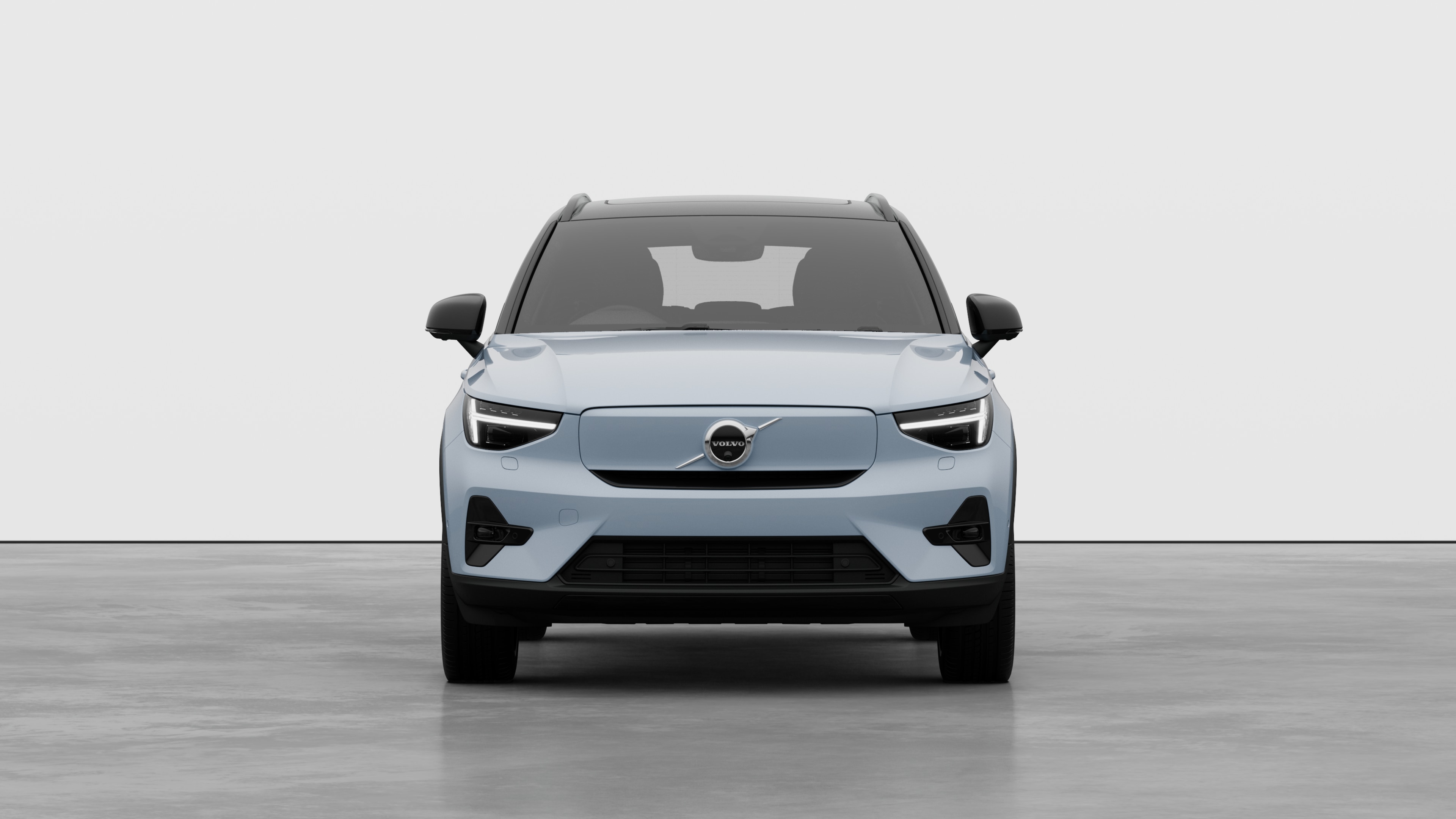 Front view of a Volvo car in a plain studio background.