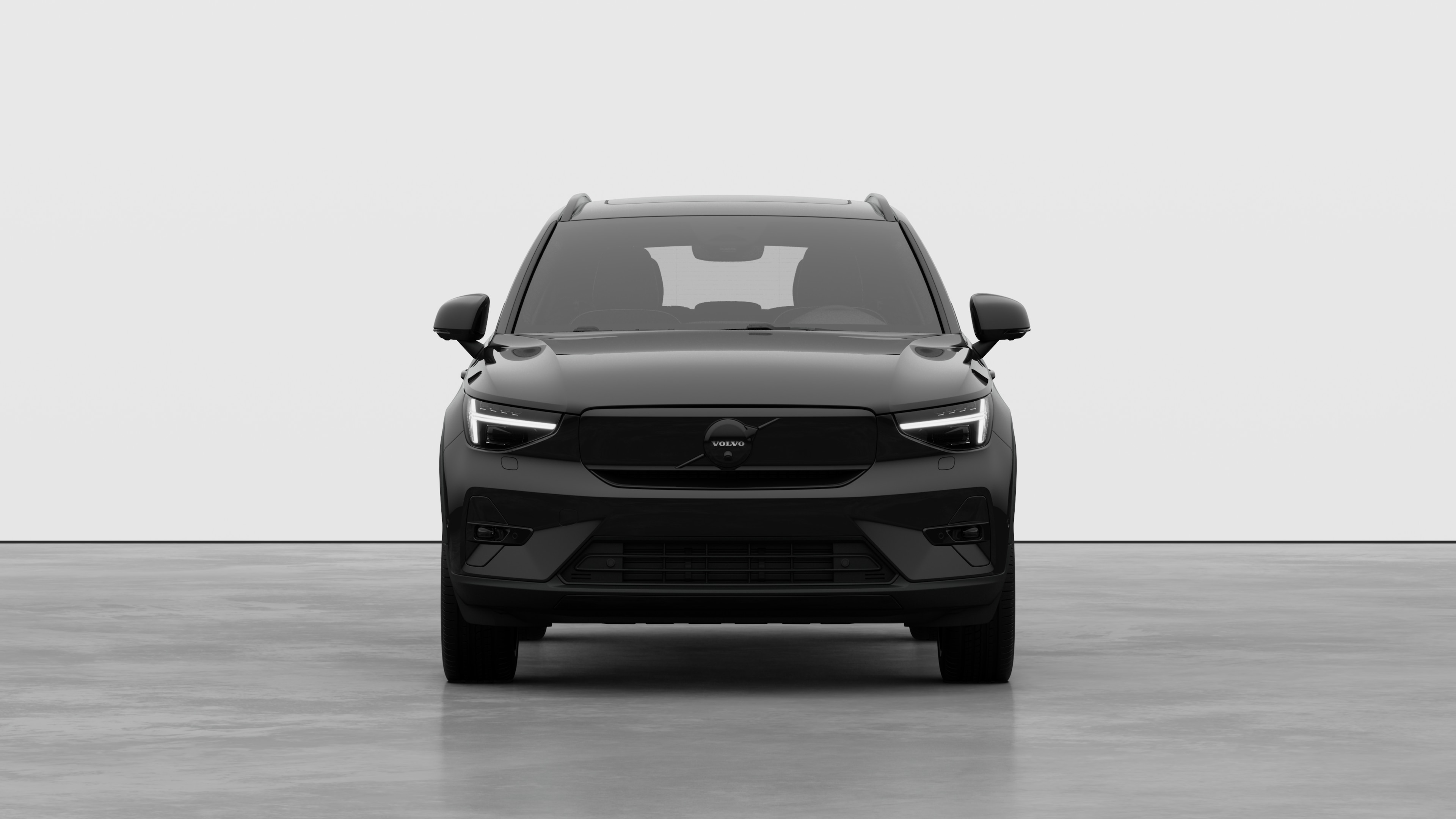 Front view of a Volvo car in a plain studio background.