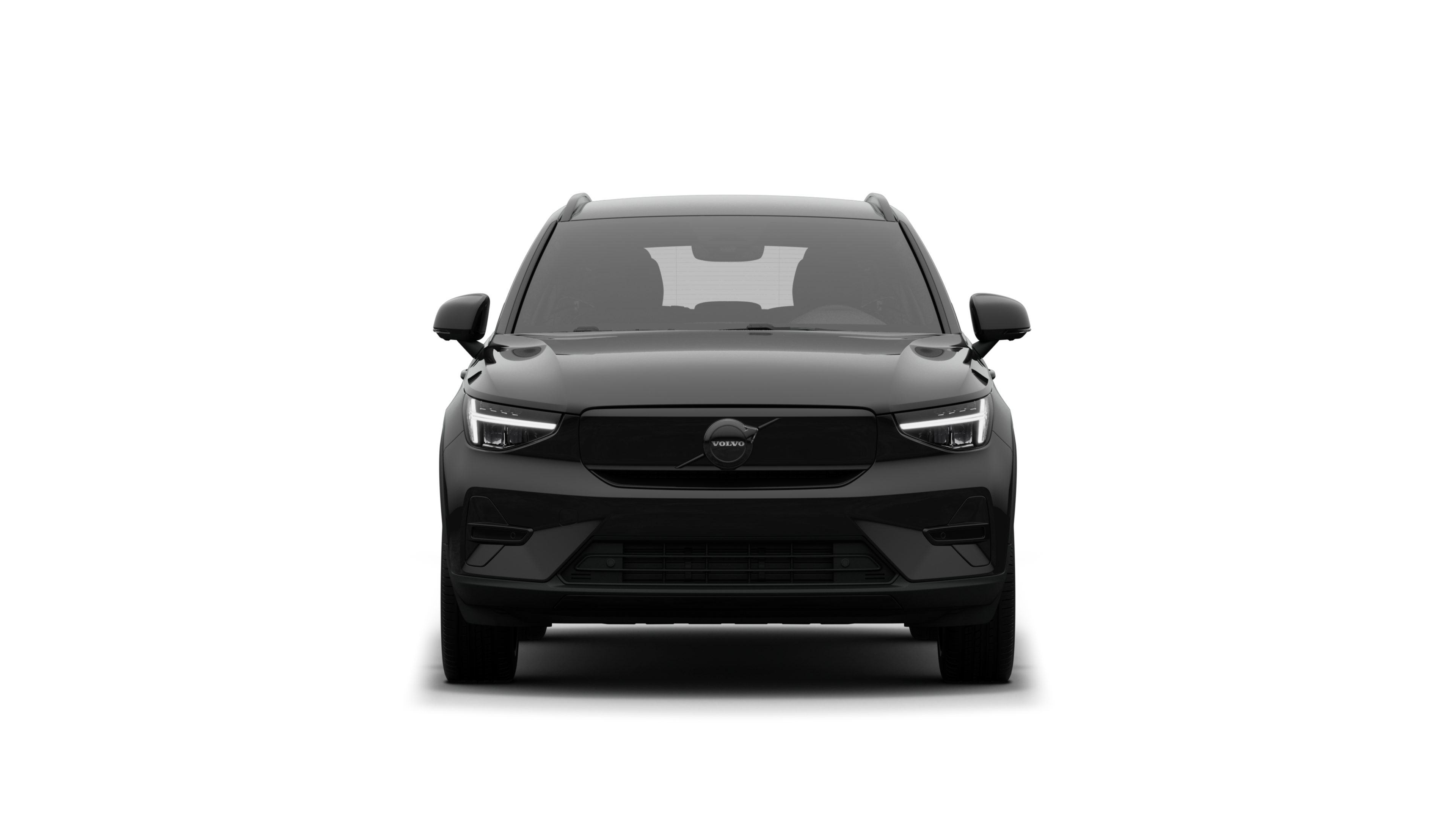 Egy Volvo autó elölnézete egyszerű stúdióháttérben.