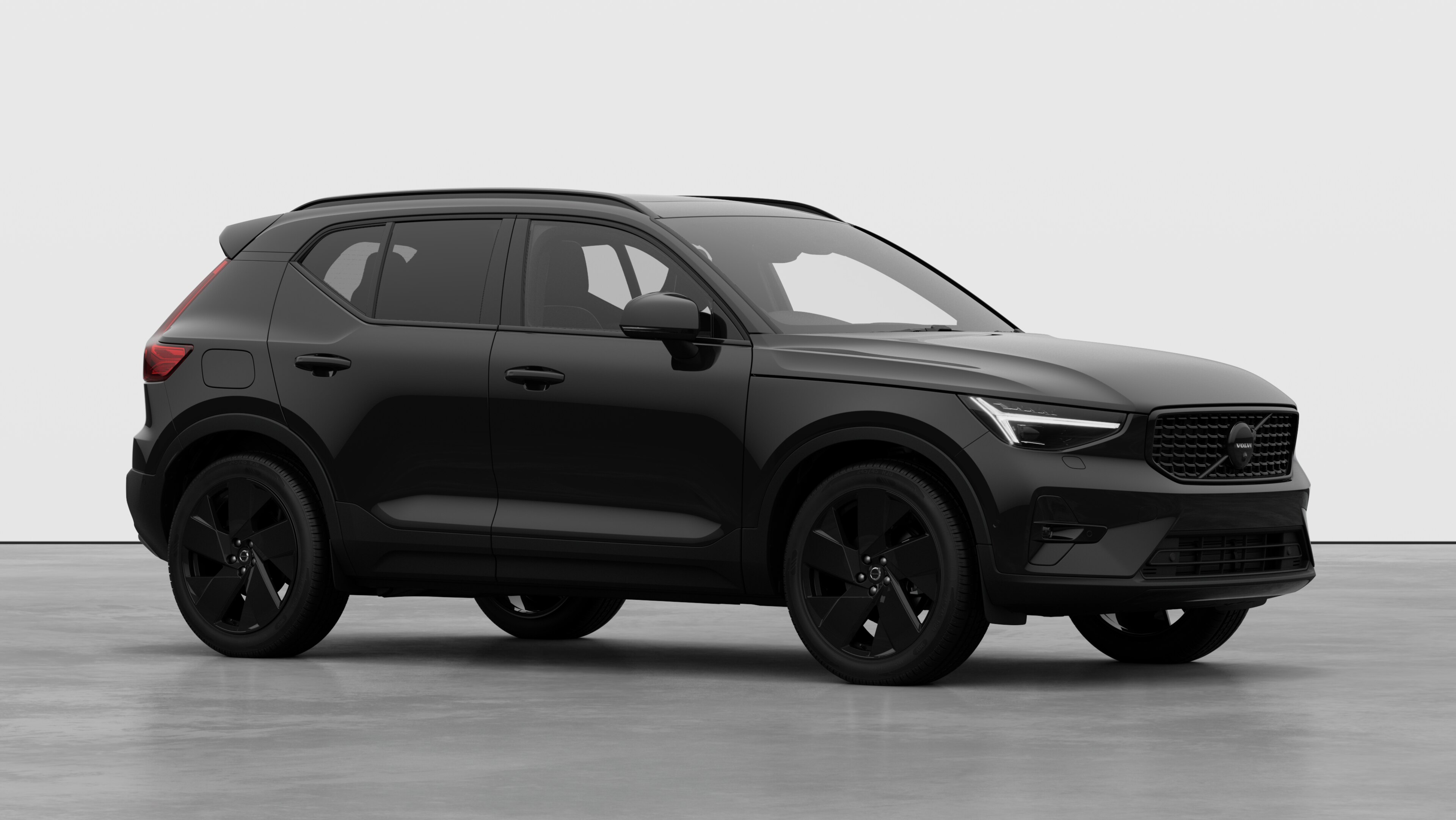 Volvo car exterior, three-quarter view in a plain studio background.