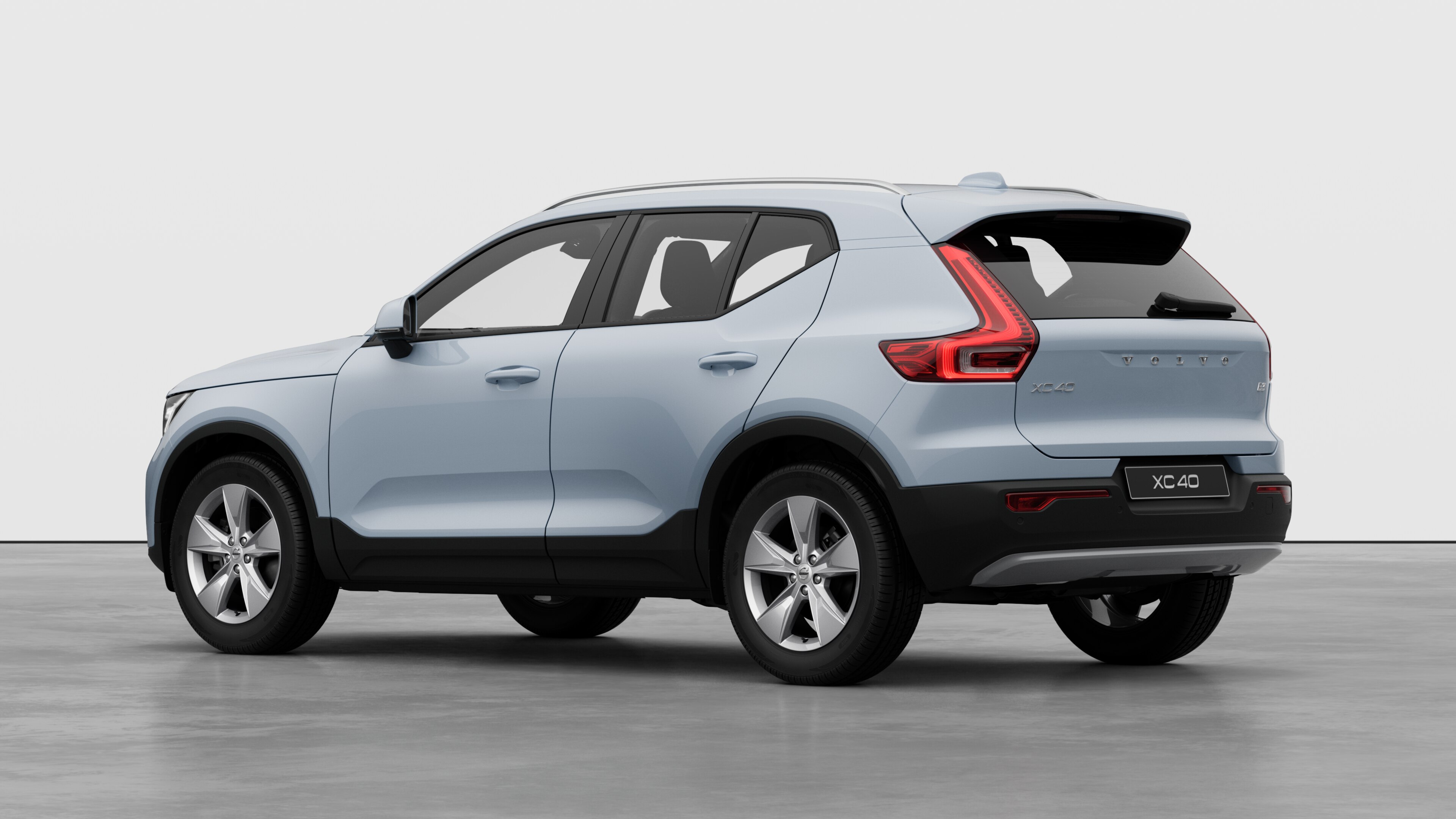 Volvo car rear three-quarter view in a plain studio background.
