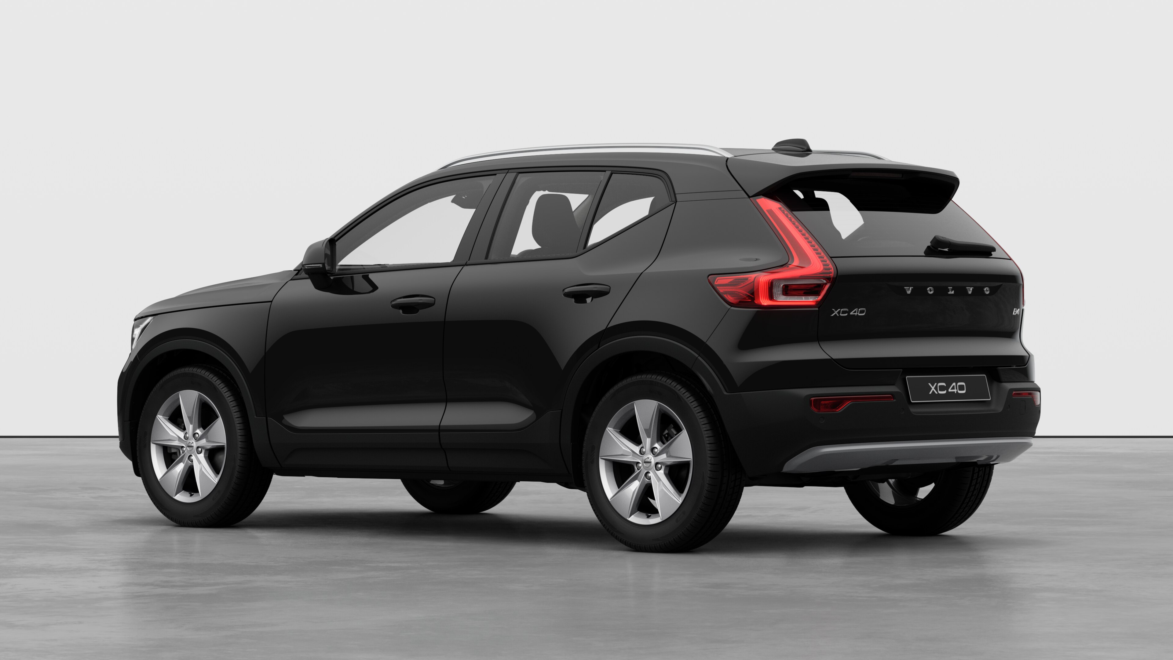 Volvo car rear three-quarter view in a plain studio background.