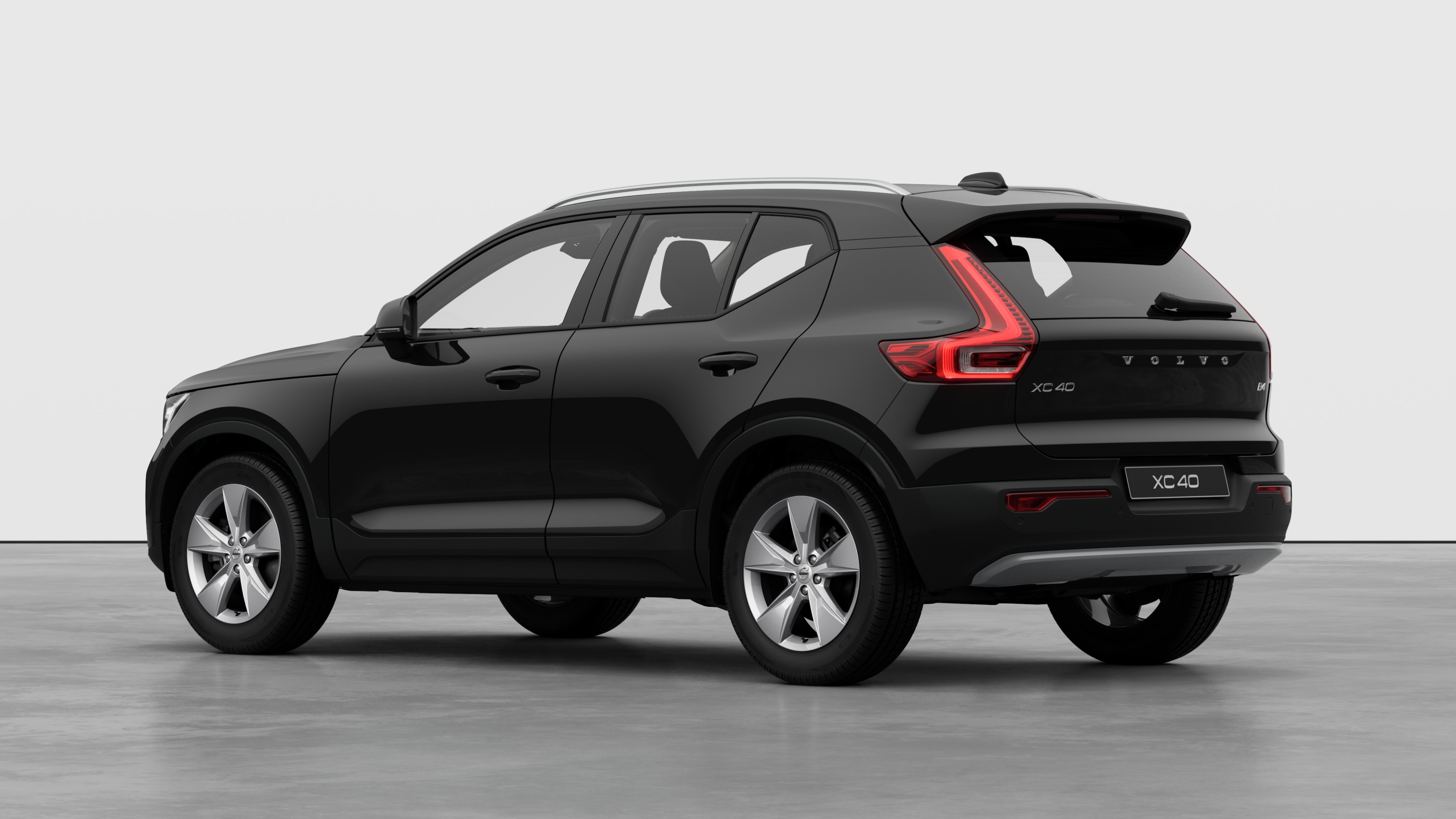 Volvo car rear three-quarter view in a plain studio background.