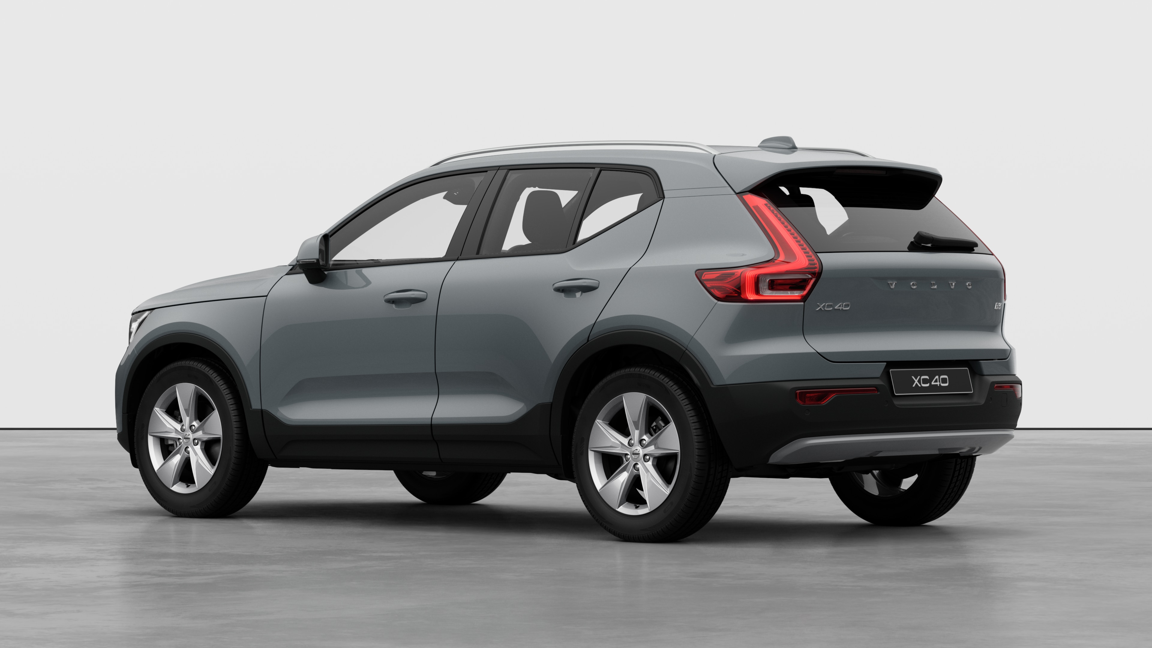 Volvo car rear three-quarter view in a plain studio background.