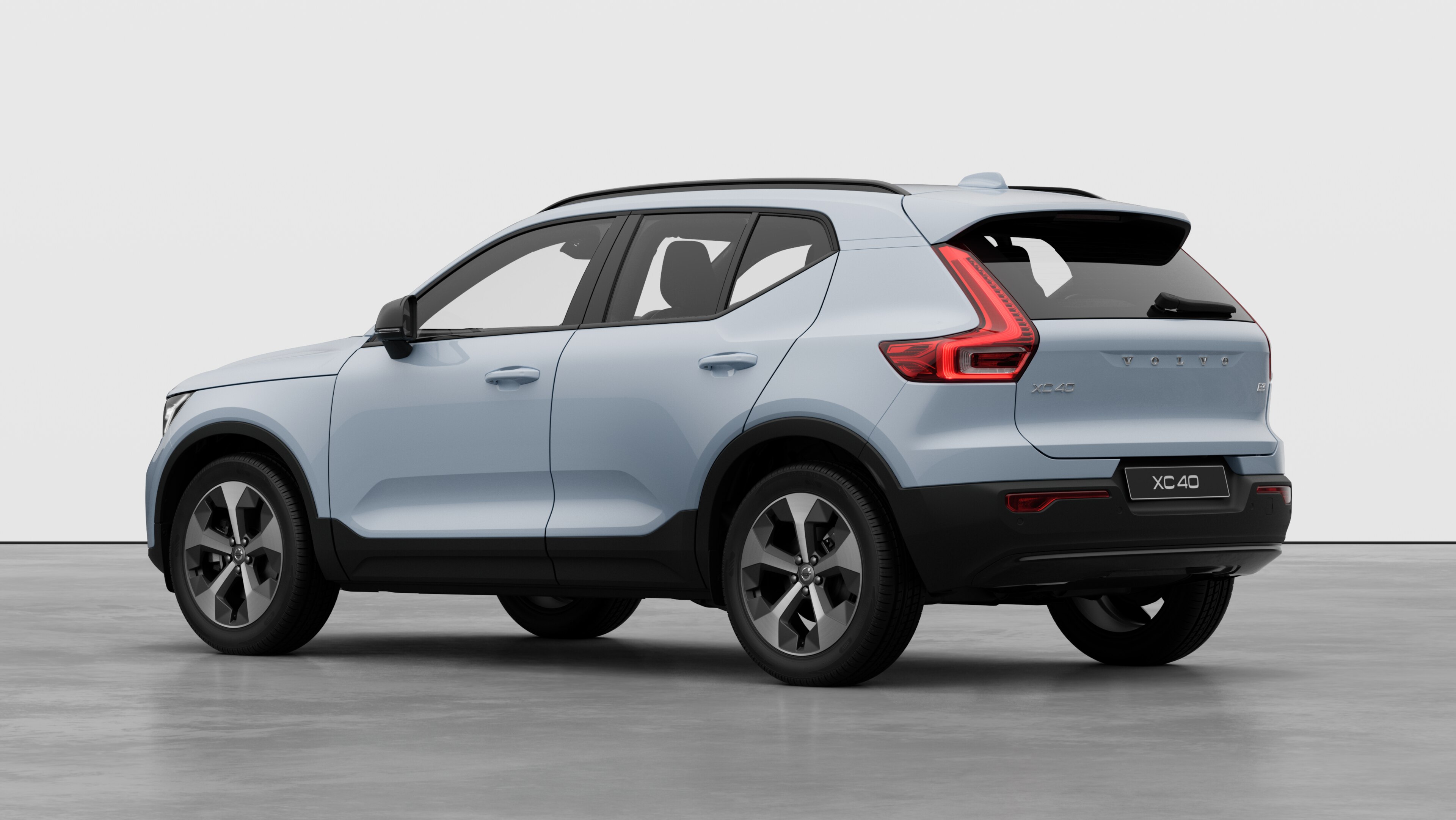 Volvo car rear three-quarter view in a plain studio background.