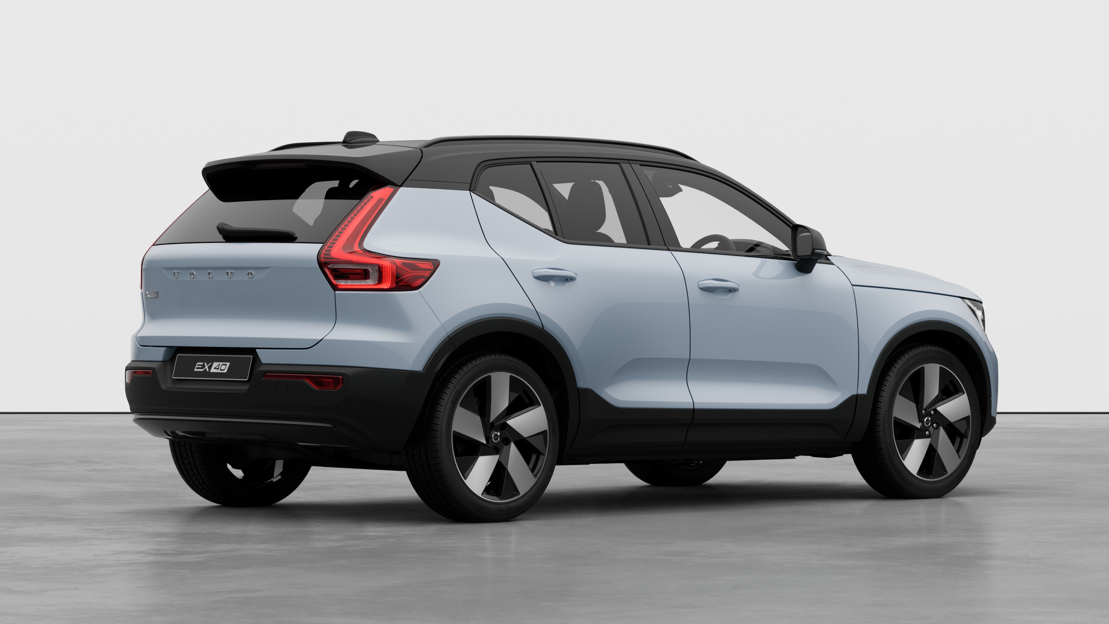 Volvo car rear three-quarter view on plain studio background.