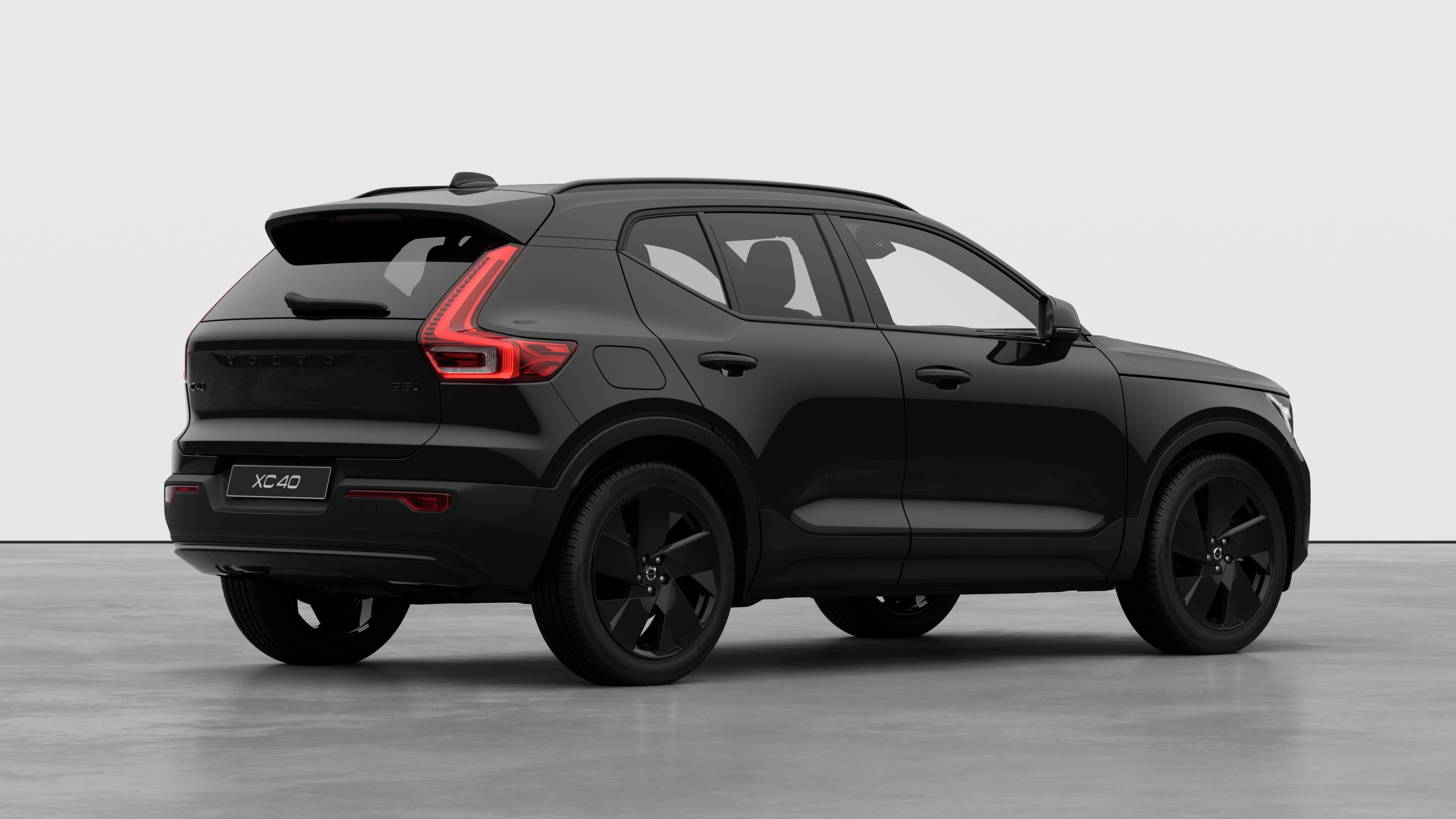 Volvo car rear three-quarter view on plain studio background.