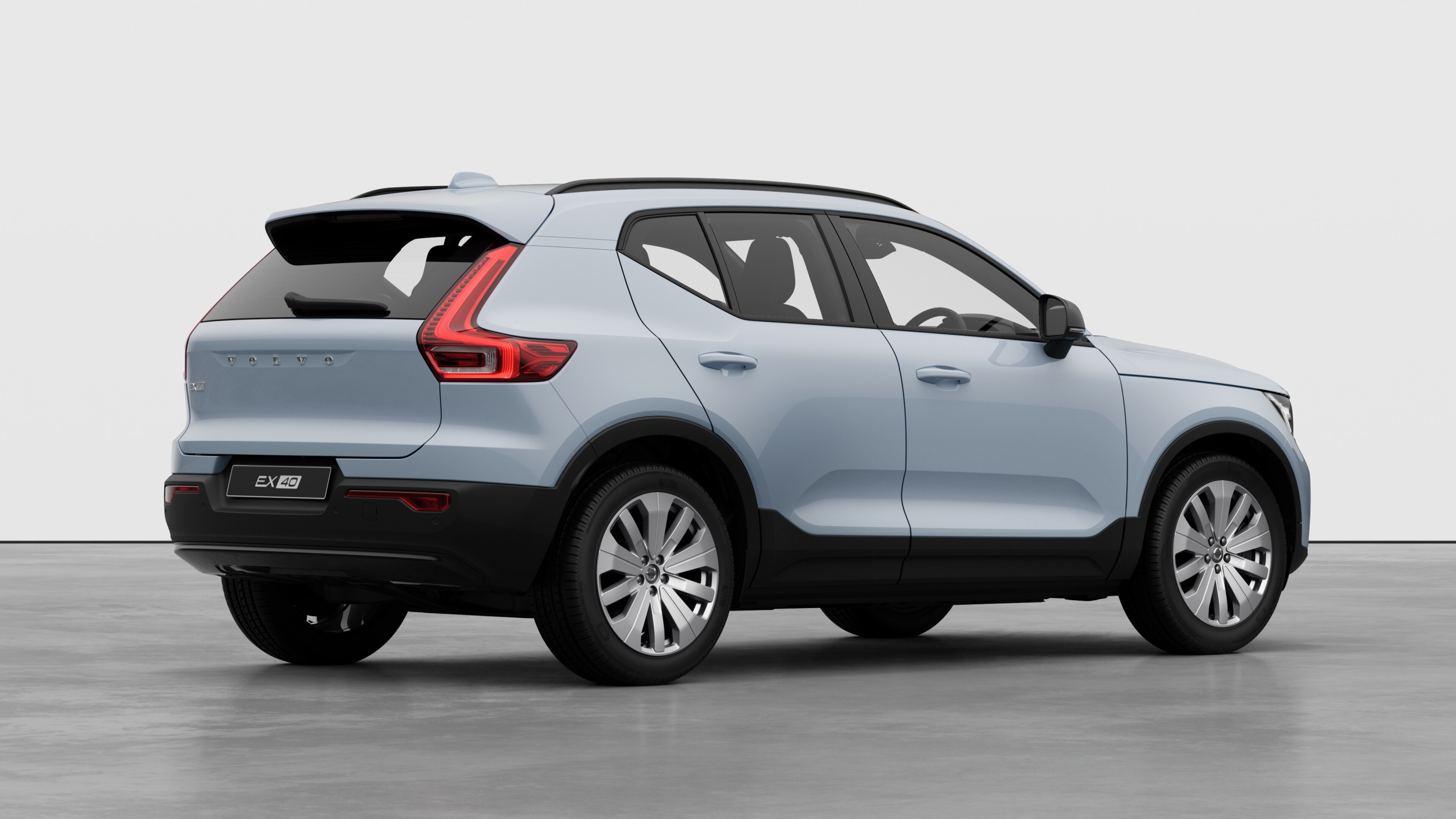 Volvo car rear three-quarter view on plain studio background.