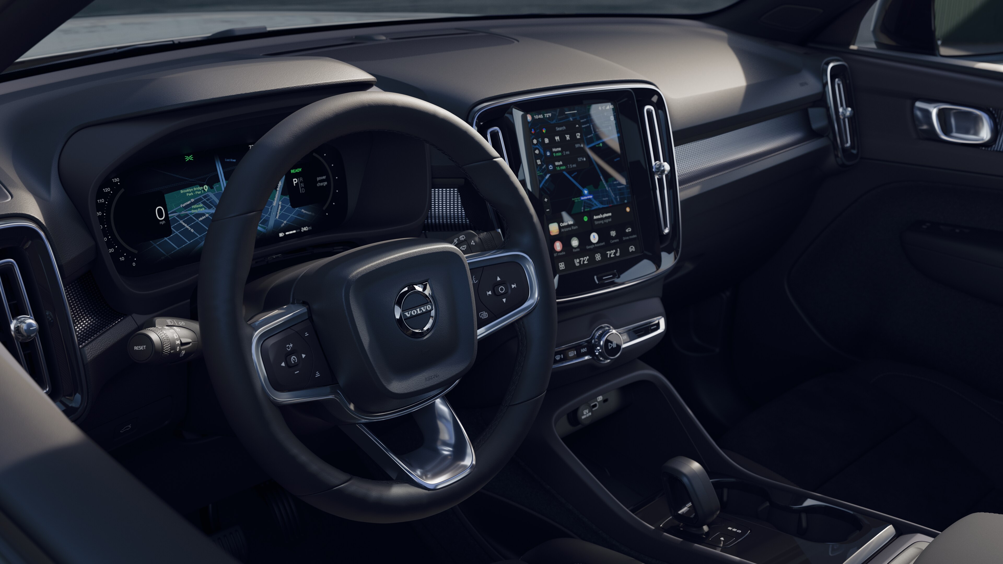 Volvo car interior showing dashboard, steering wheel, and center console with digital display in an open road background.