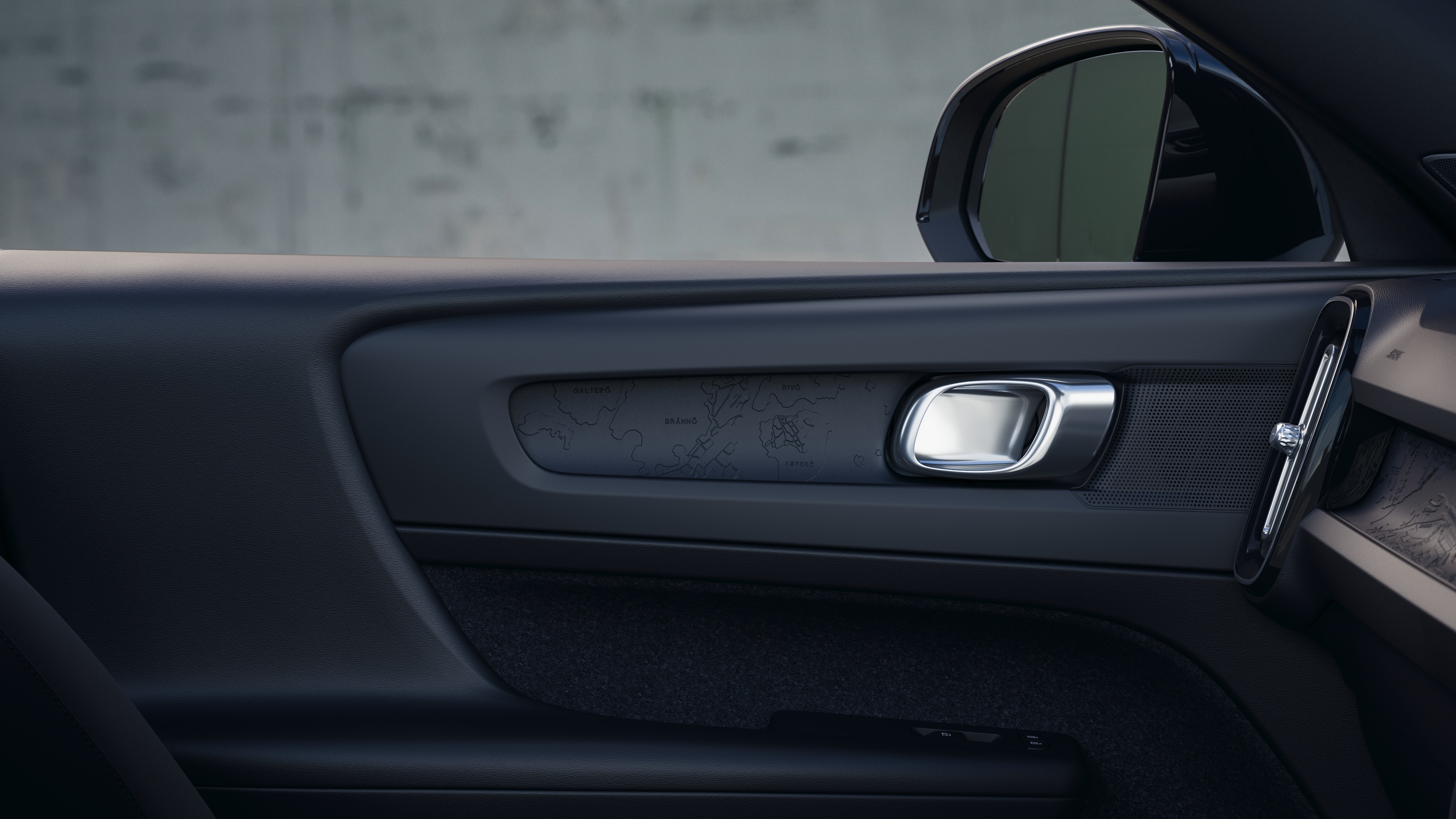 Volvo car interior showing front and rear passenger seats, steering wheel, dashboard, and center console against a plain studio background.