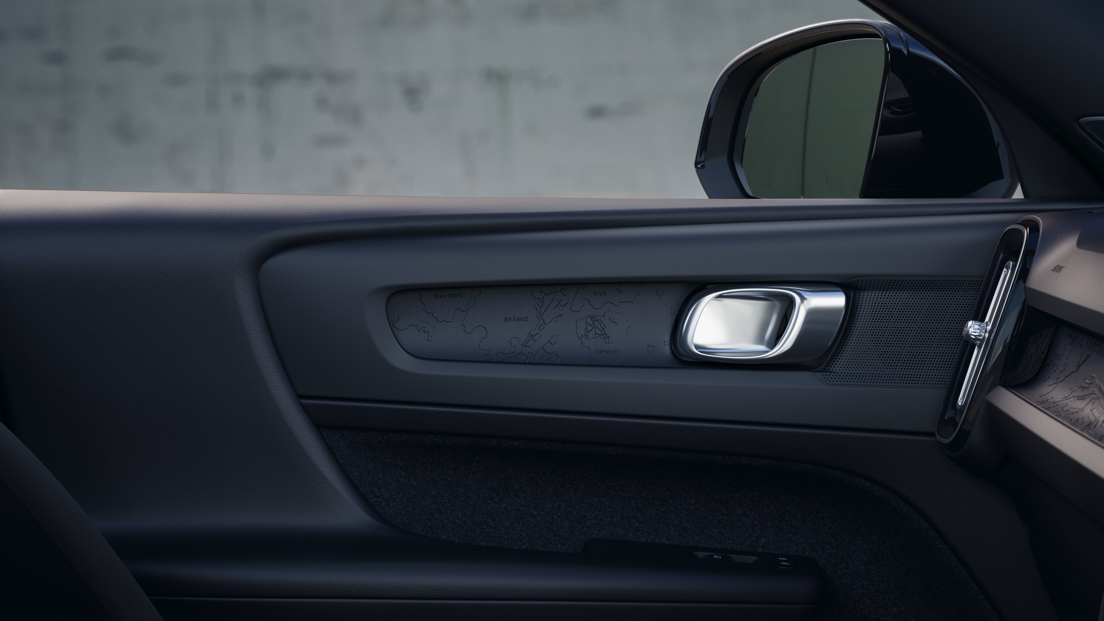 Volvo car interior showing front and rear passenger seats, steering wheel, dashboard, and center console against a plain studio background.