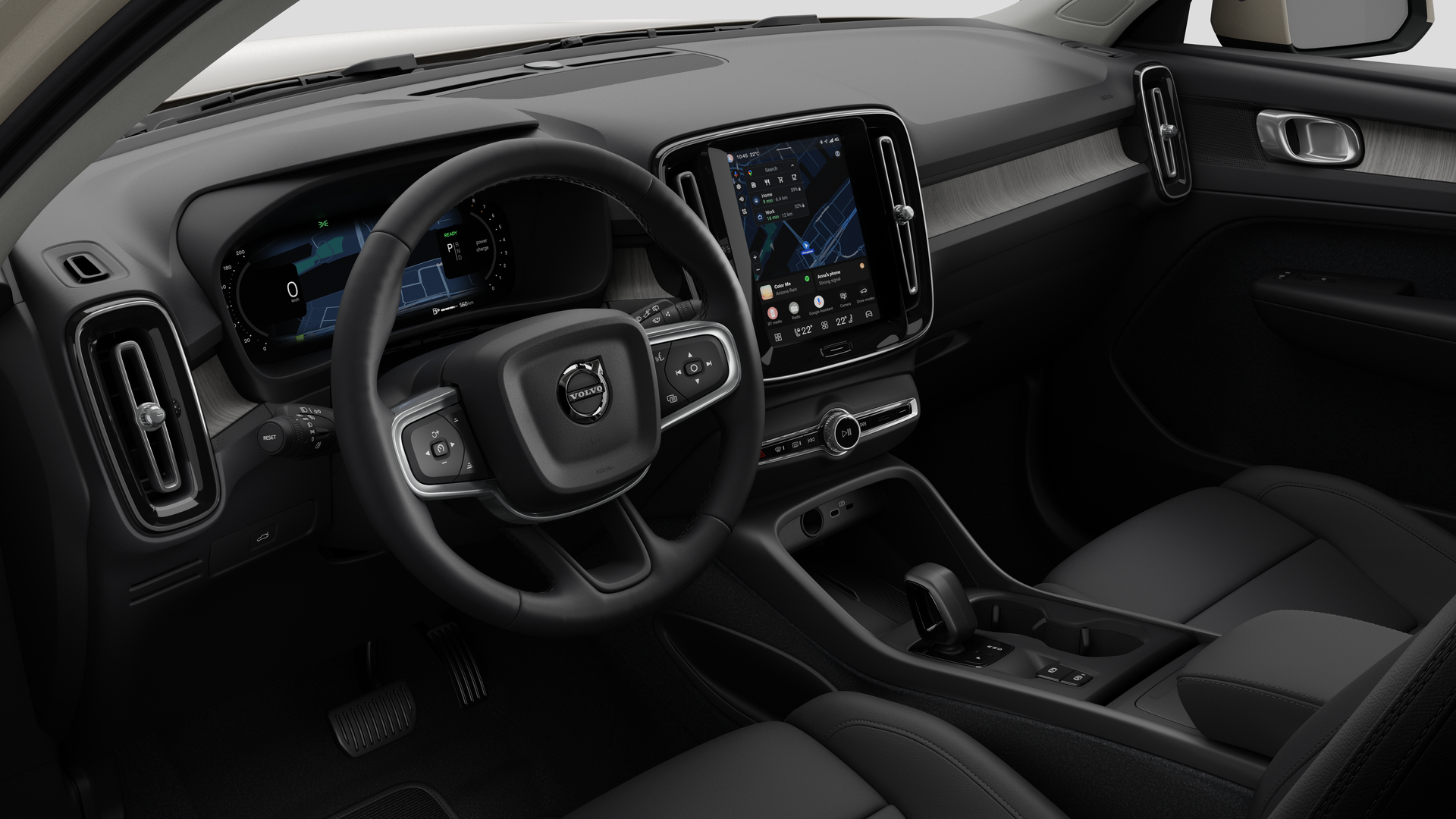 Volvo 汽車的內部視圖，以純色工作室背景顯示儀錶板、方向盤、中控台和數字顯示幕。