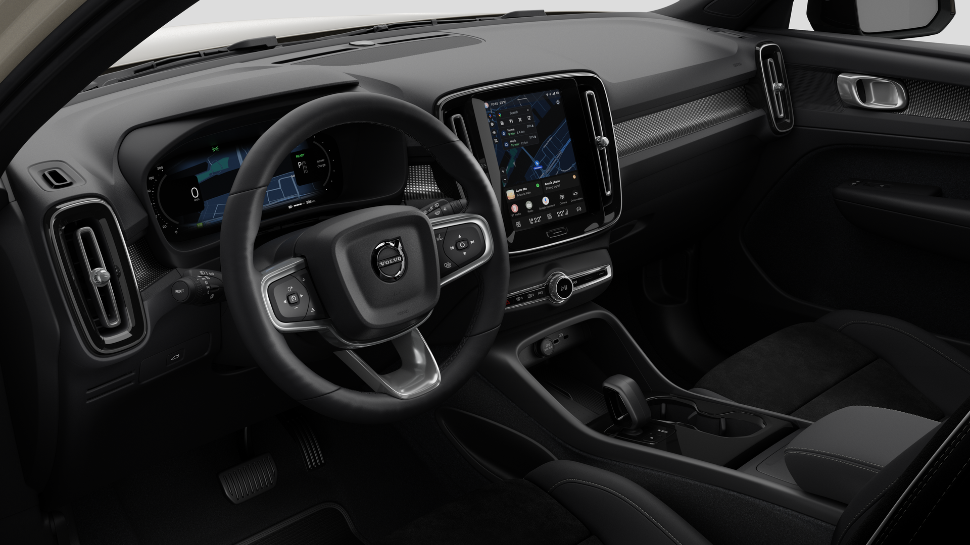 Volvo 汽車的內部視圖，以純色工作室背景顯示儀錶板、方向盤、中控台和數字顯示幕。