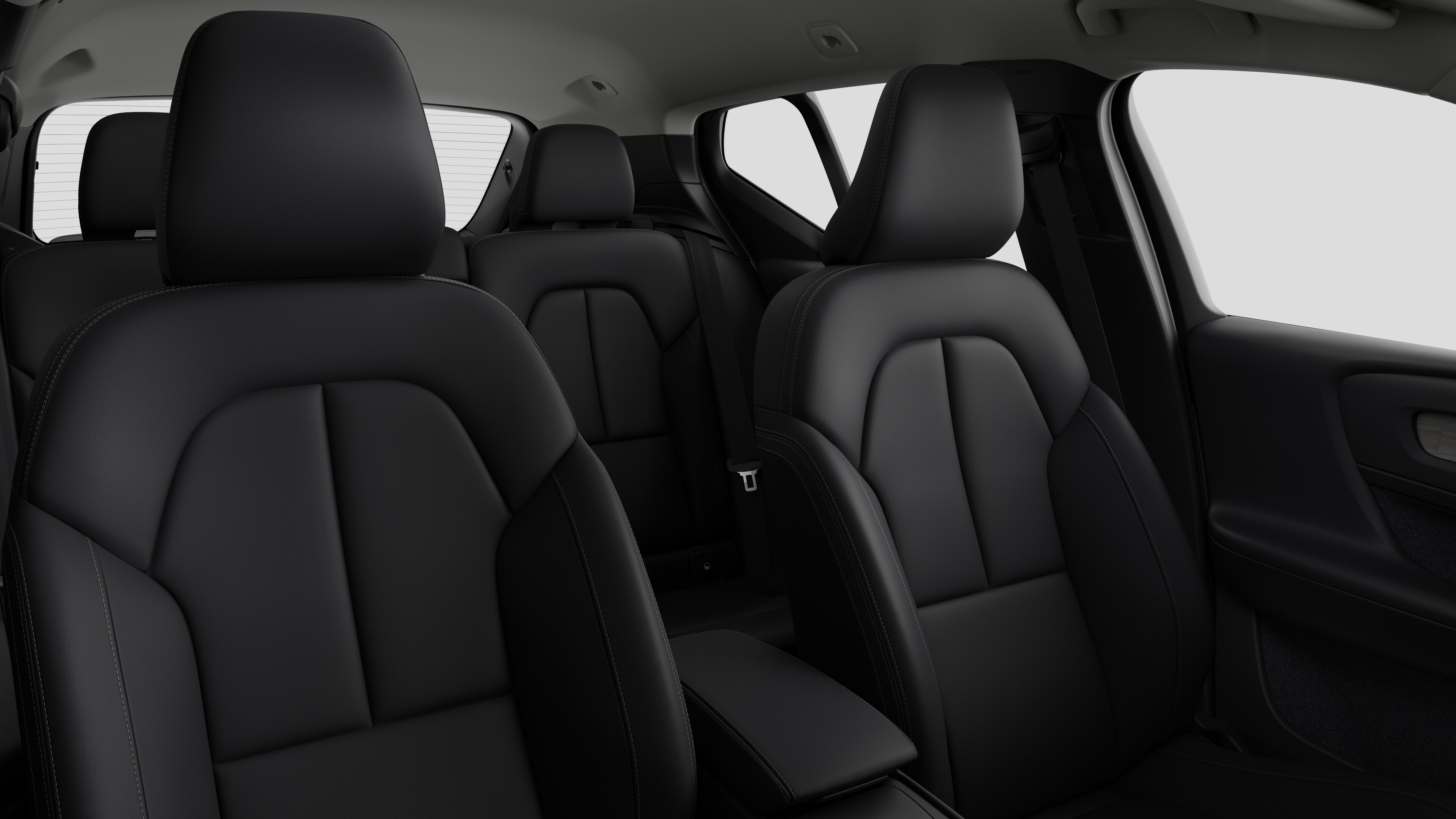 Volvo car interior showing rear passenger seats and center console in plain studio background.