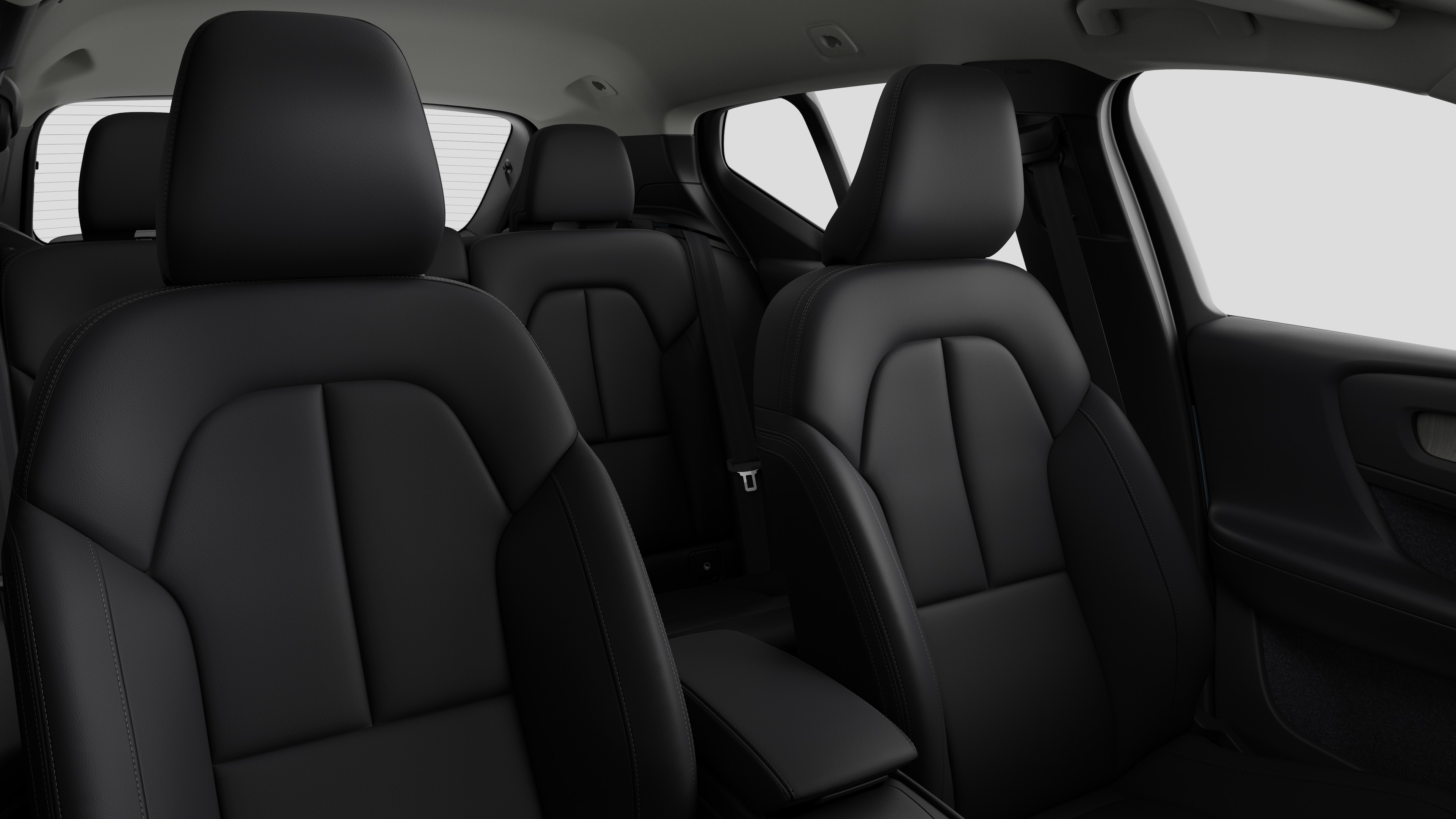 Volvo car interior showing rear passenger seats and center console in plain studio background.
