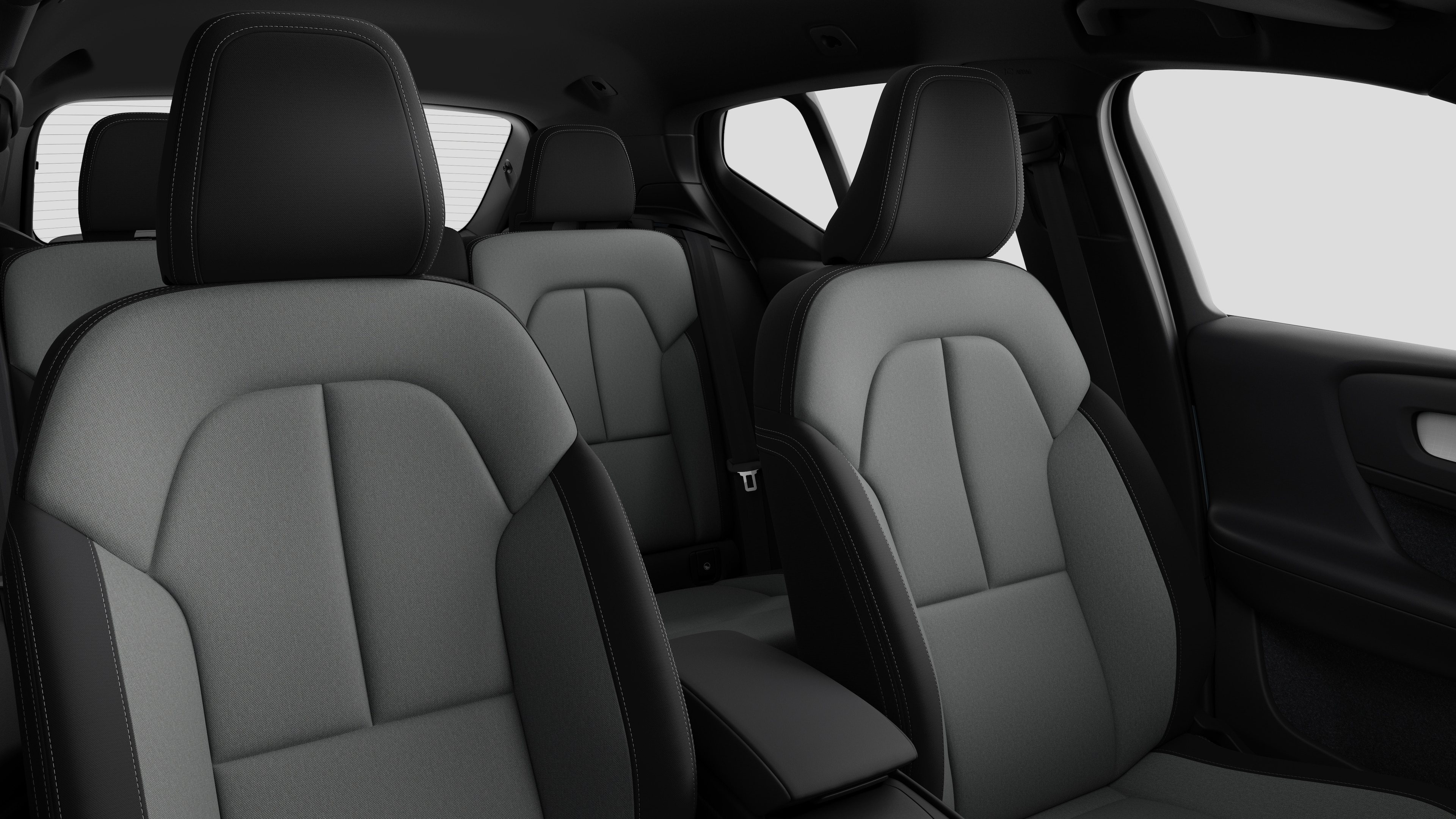 Volvo car interior showing rear passenger seats and center console in plain studio background.