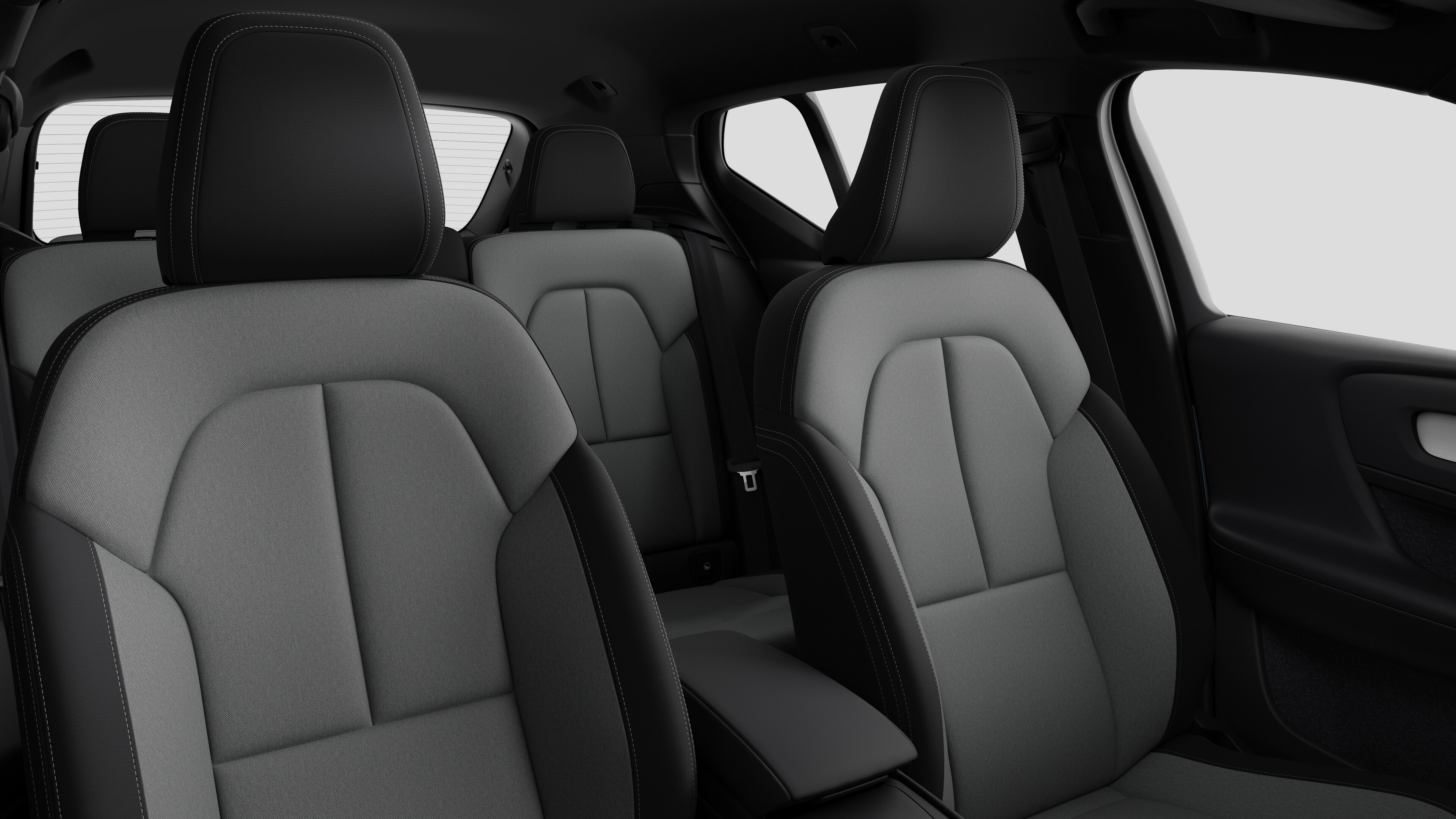 Volvo car interior showing rear passenger seats and center console in plain studio background.