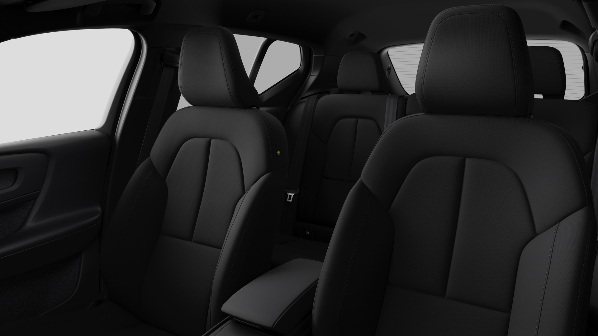 Intérieur d’une Volvo montrant les sièges passagers arrière et la console centrale dans un studio uni.