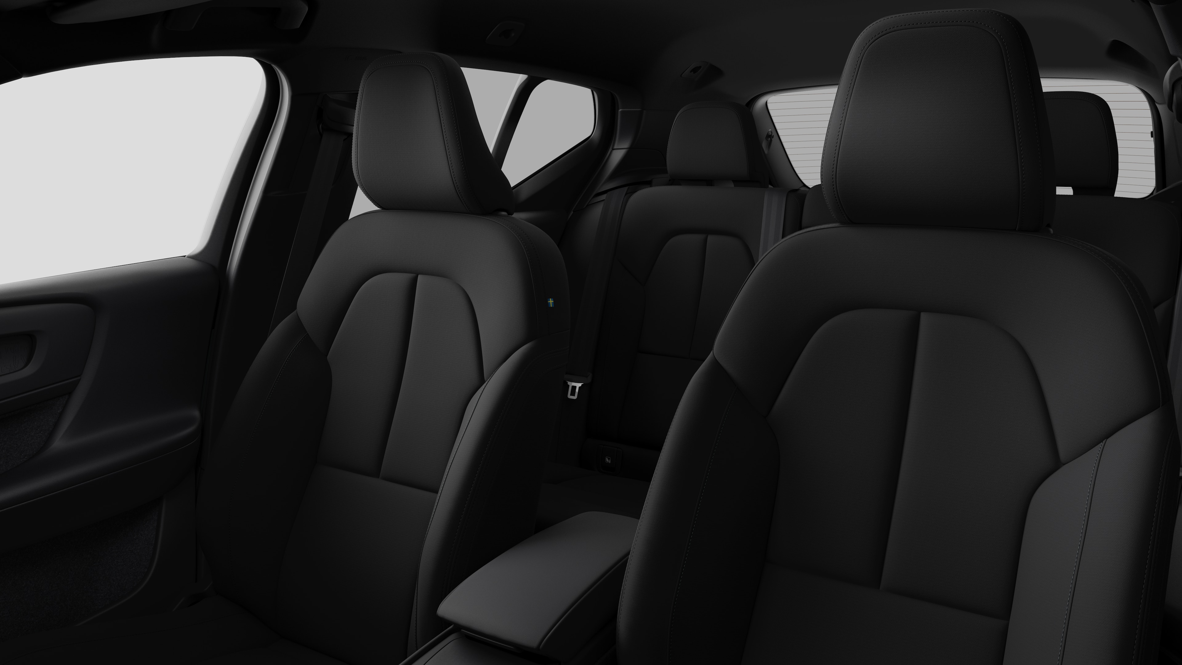 Intérieur d’une Volvo montrant les sièges passagers arrière et la console centrale dans un studio uni.
