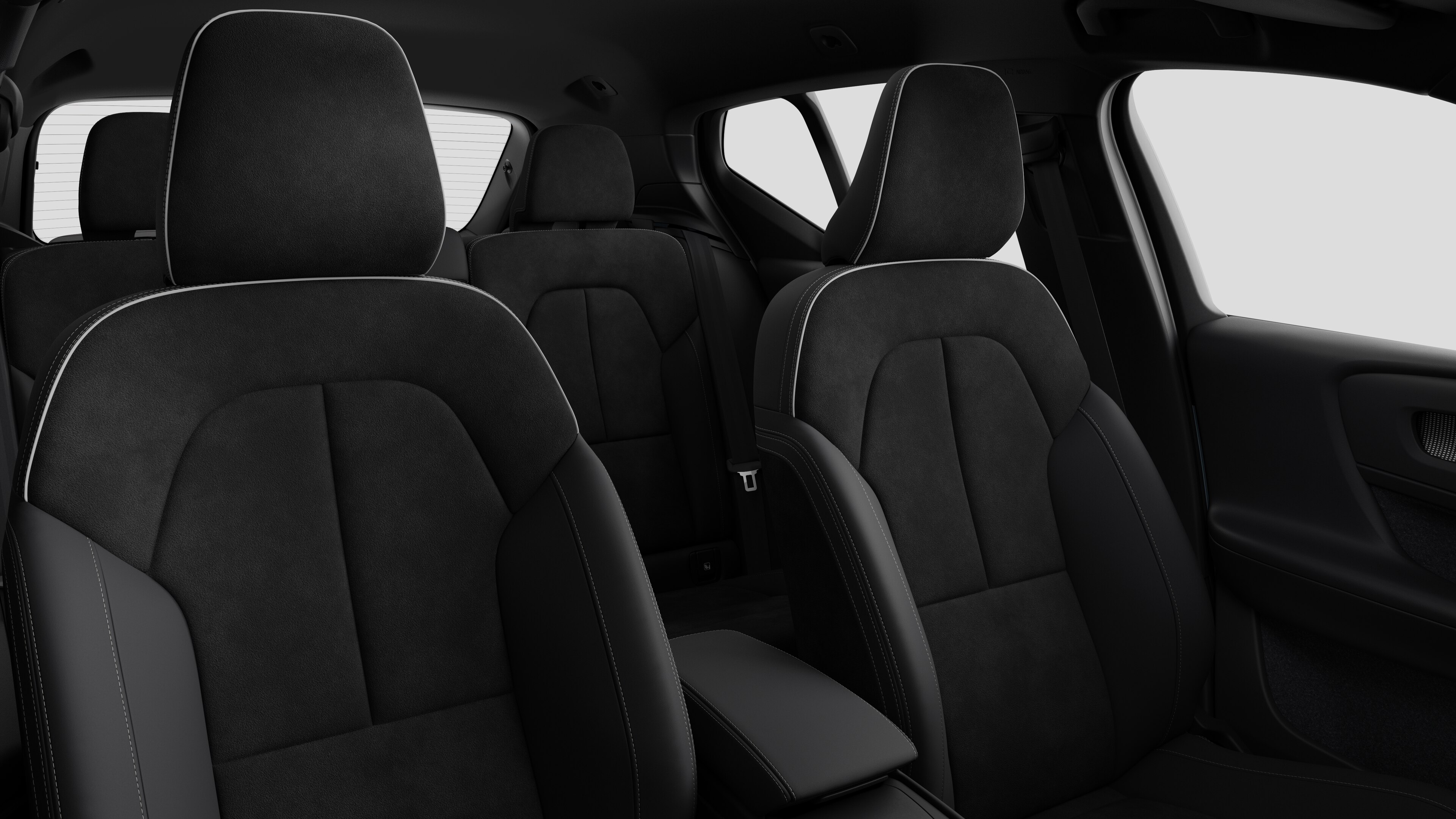 Volvo car interior showing rear passenger seats and center console in plain studio background.