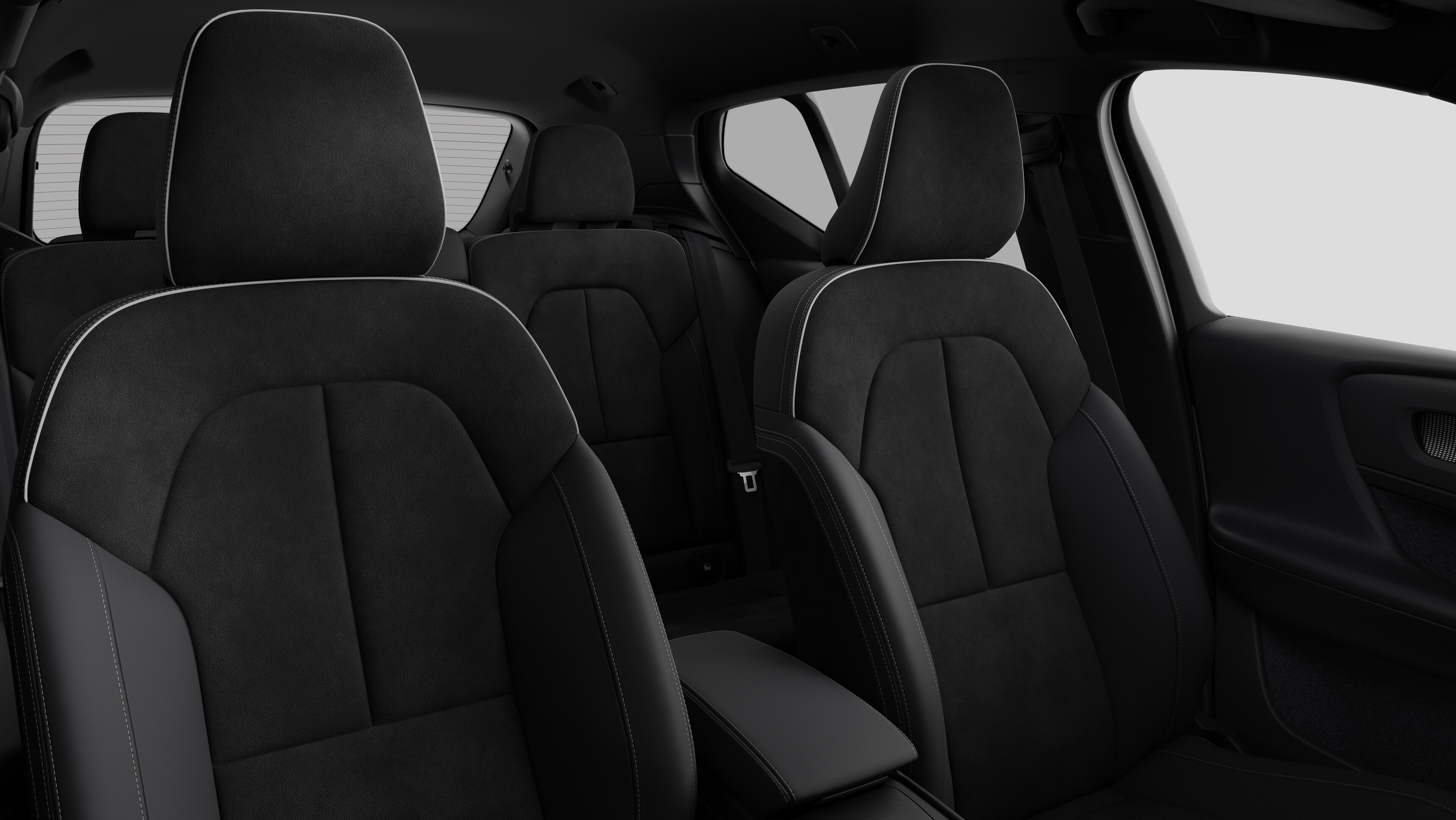 Volvo car interior showing rear passenger seats and center console in plain studio background.