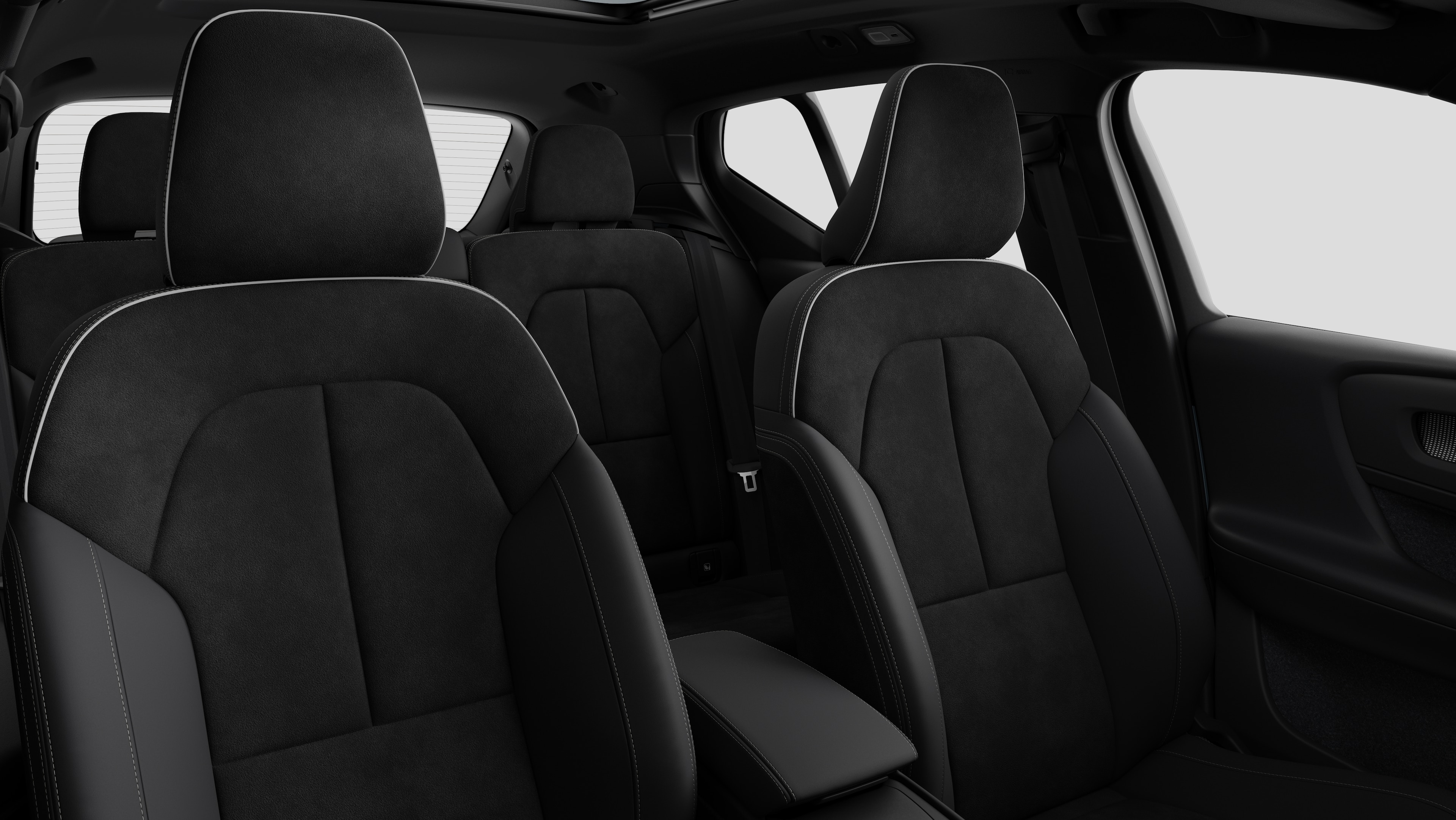 Volvo car interior showing rear passenger seats and center console in plain studio background.