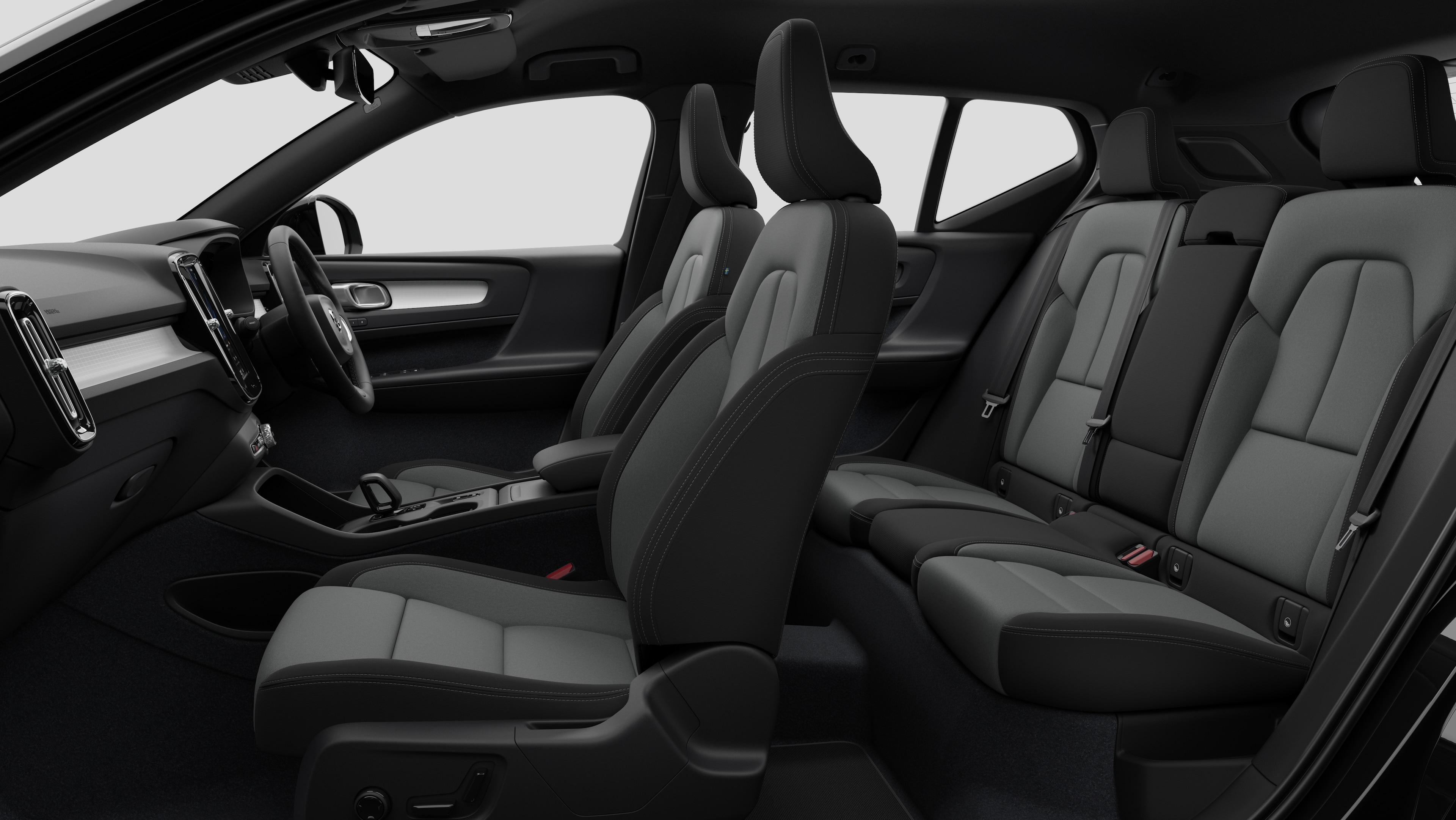 Volvo car interior side view showcasing front seats, rear passenger seats, steering wheel, dashboard, and center console, set against plain studio background.