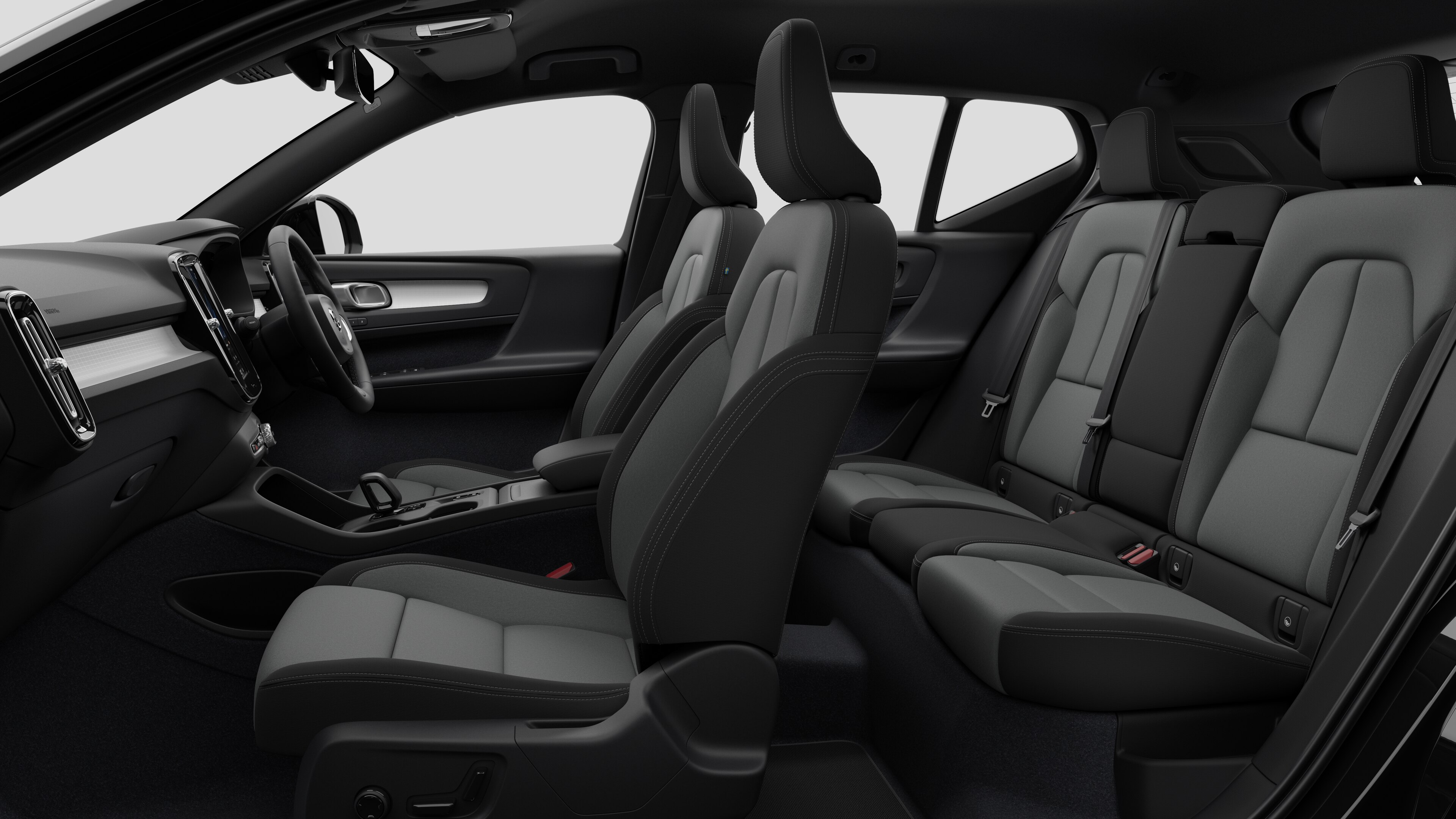 Volvo car interior side view showcasing front seats, rear passenger seats, steering wheel, dashboard, and center console, set against plain studio background.
