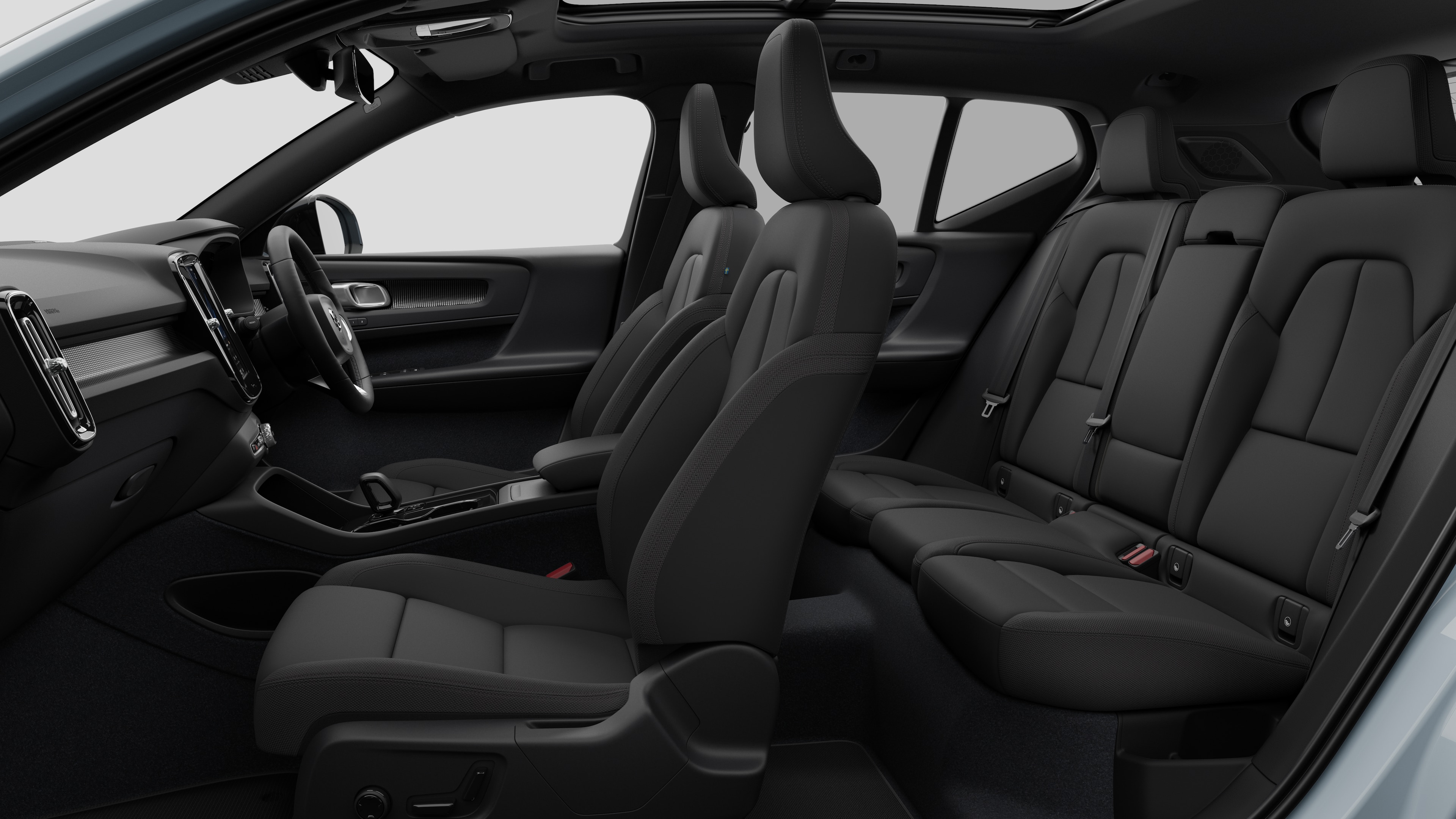 Volvo car interior side view showcasing front seats, rear passenger seats, steering wheel, dashboard, and center console, set against plain studio background.