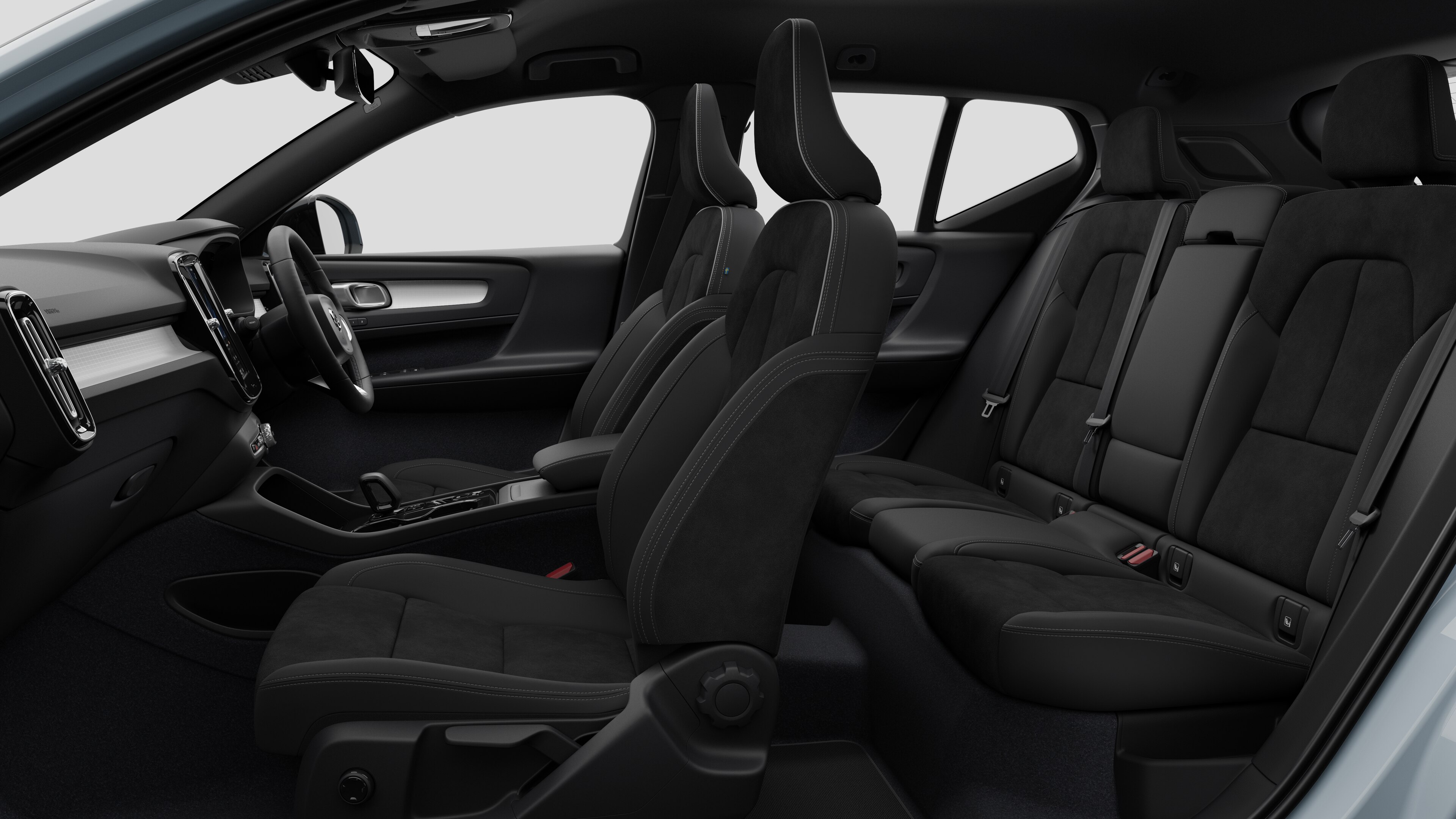 Volvo car interior side view showcasing front seats, rear passenger seats, steering wheel, dashboard, and center console, set against plain studio background.